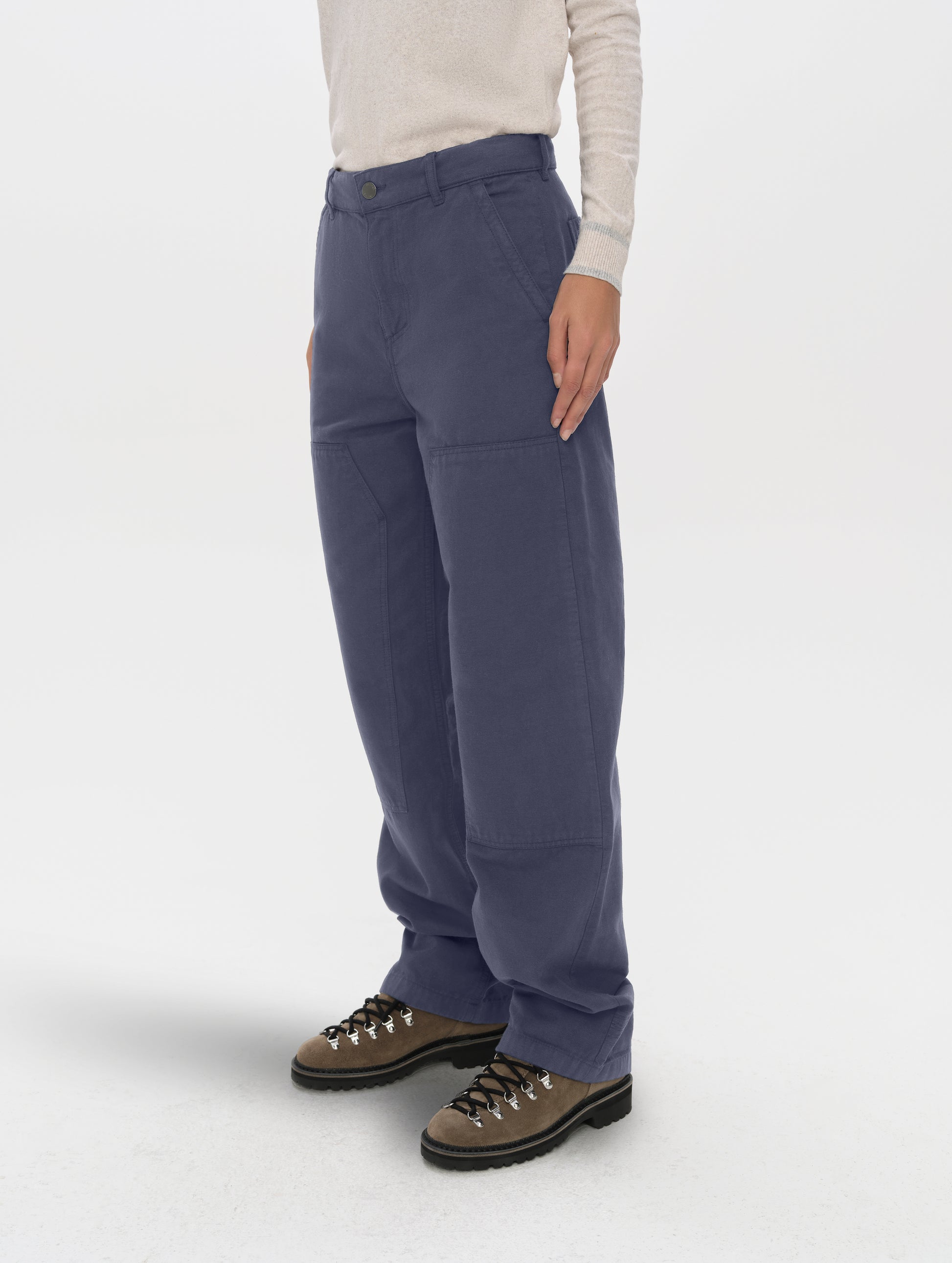 Front angled lower-body view of woman wearing the Natalie Utility Pant in Portal Blue from AETHER Apparel.