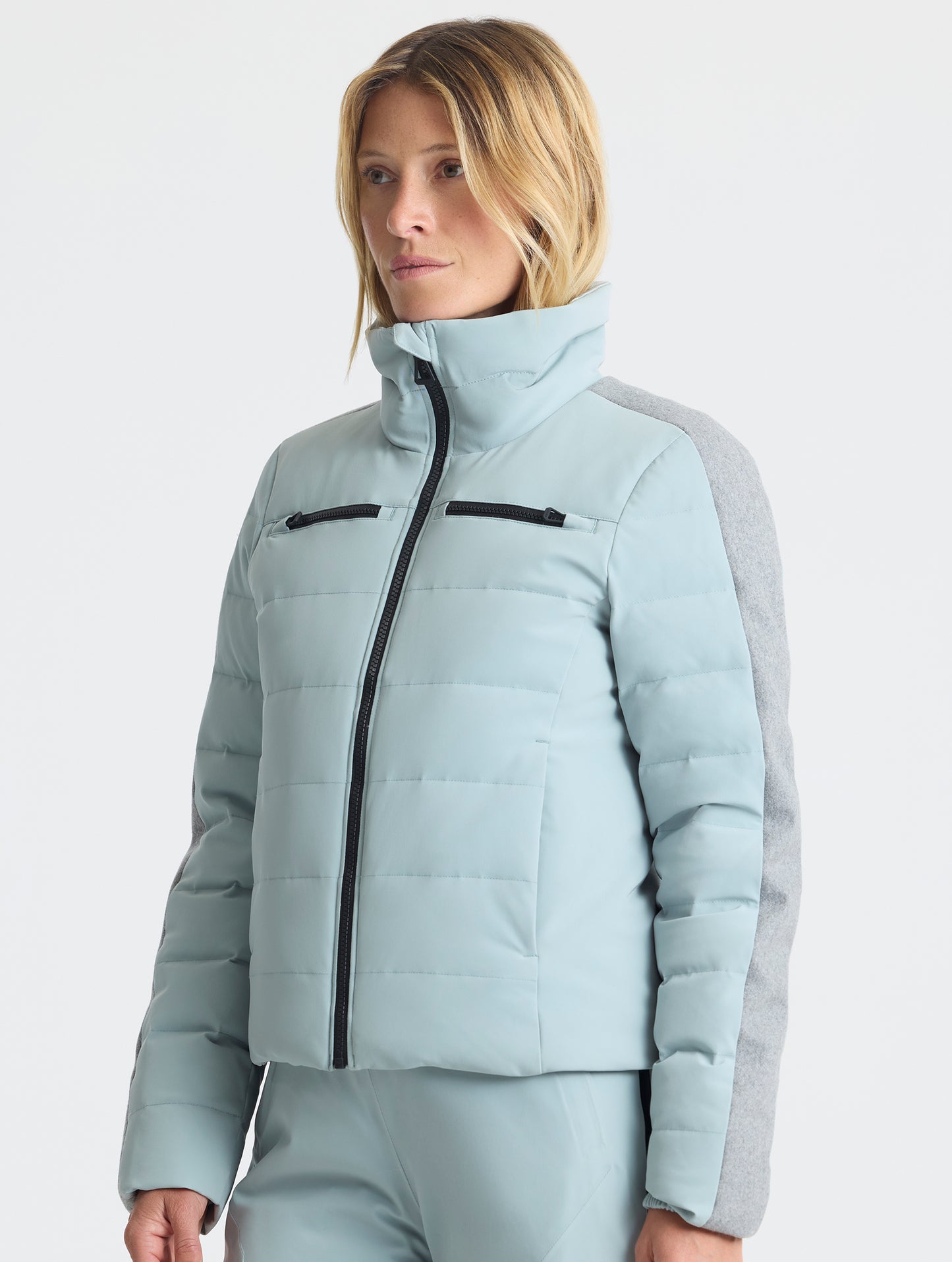 Front upper-body view of woman wearing the Nordic Jacket 2.0 in Jadewood Green from AETHER Apparel.