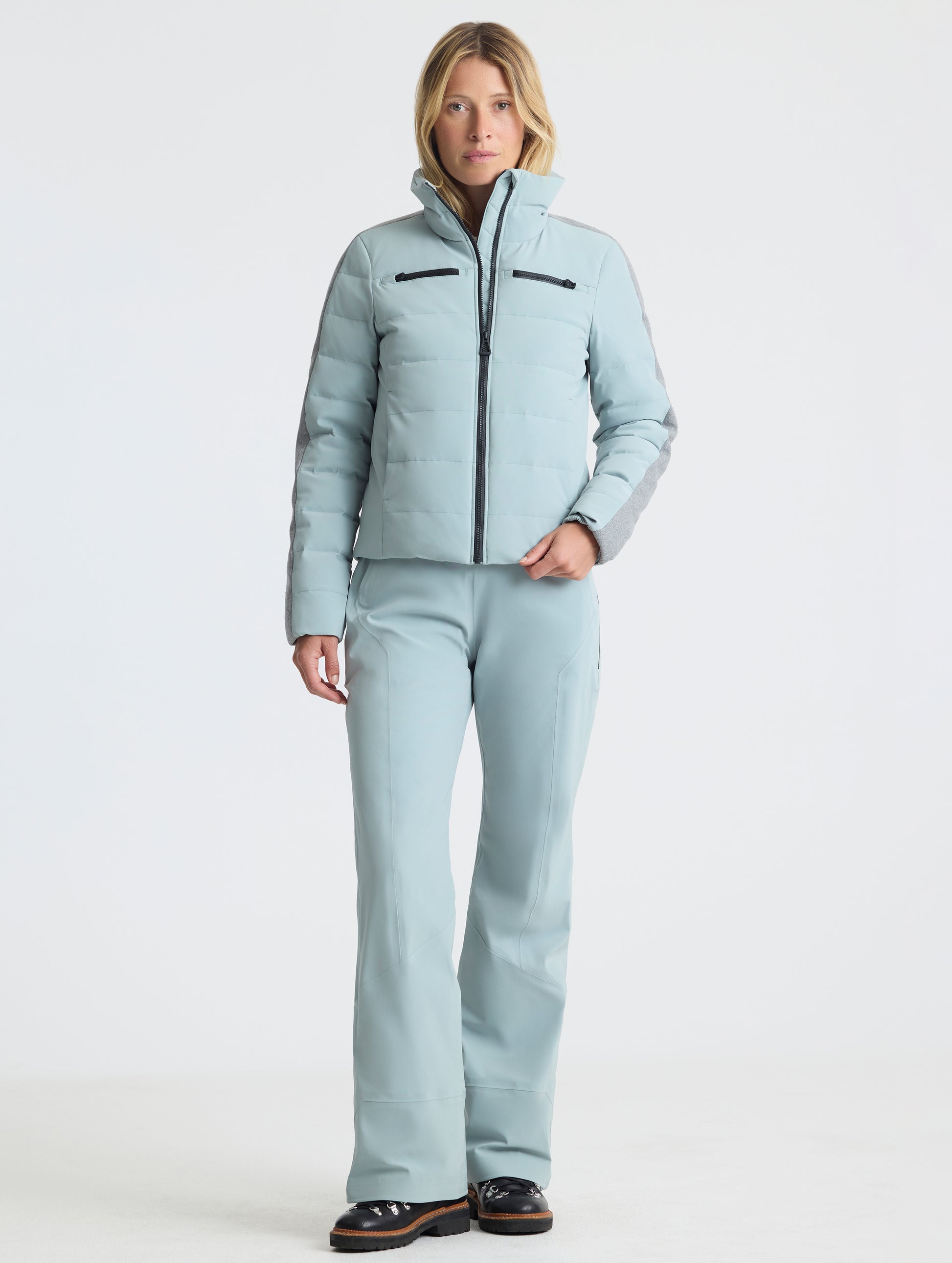 Front full-body view of woman wearing the Nordic Jacket 2.0 in Jadewood Green from AETHER Apparel.