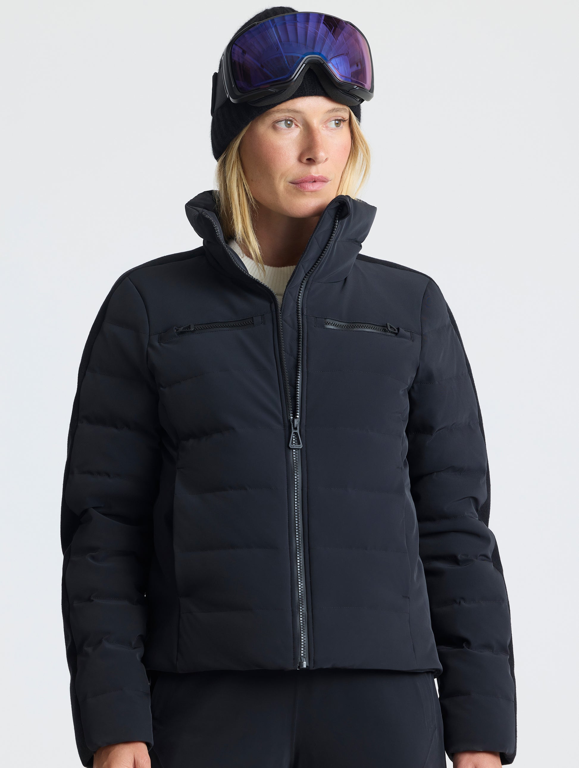Front upper-body view of woman wearing the Nordic Jacket 2.0 in Onyx Black from AETHER Apparel.