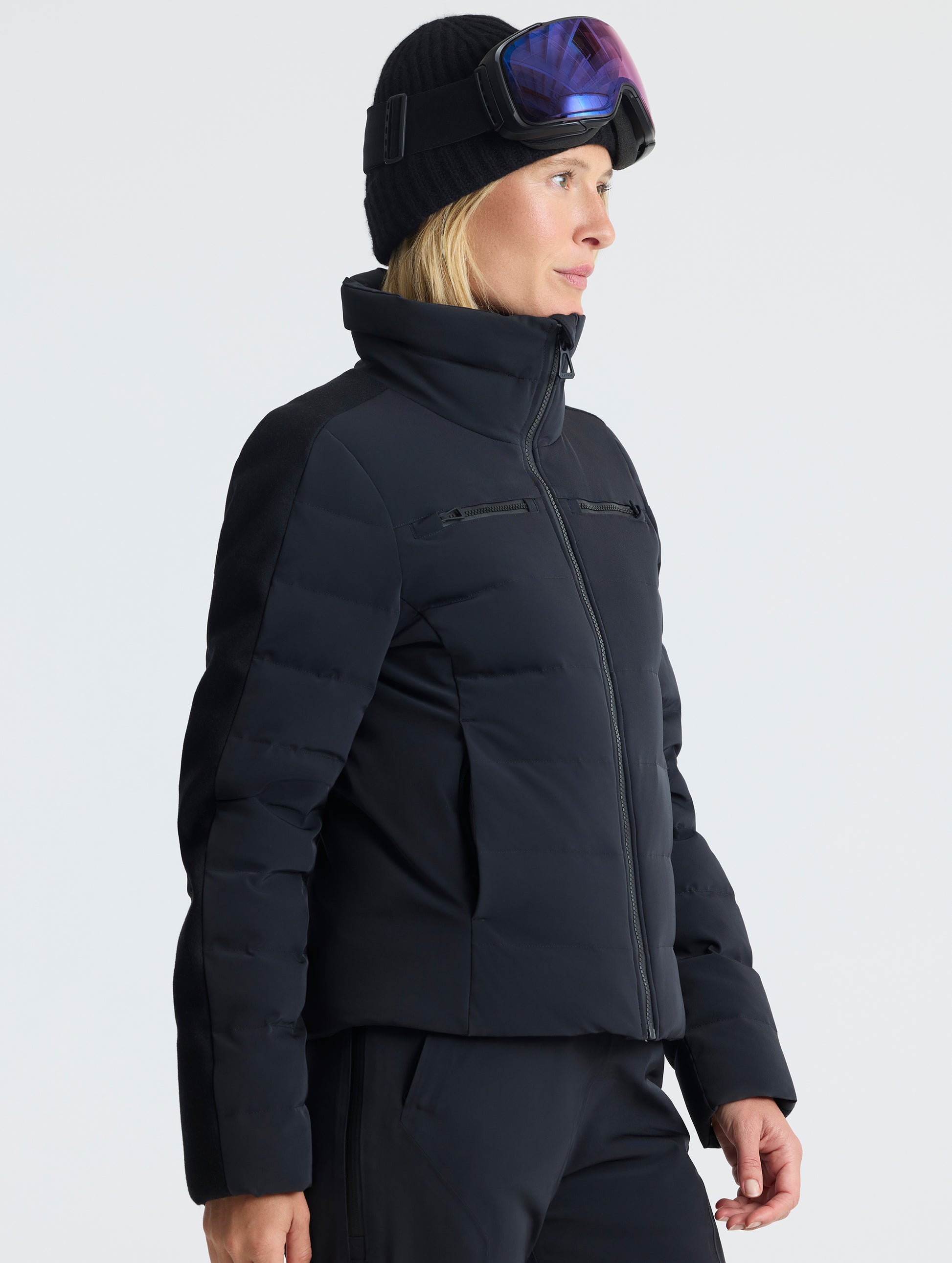 Front angled upper-body view of woman wearing the Nordic Jacket 2.0 in Onyx Black from AETHER Apparel.