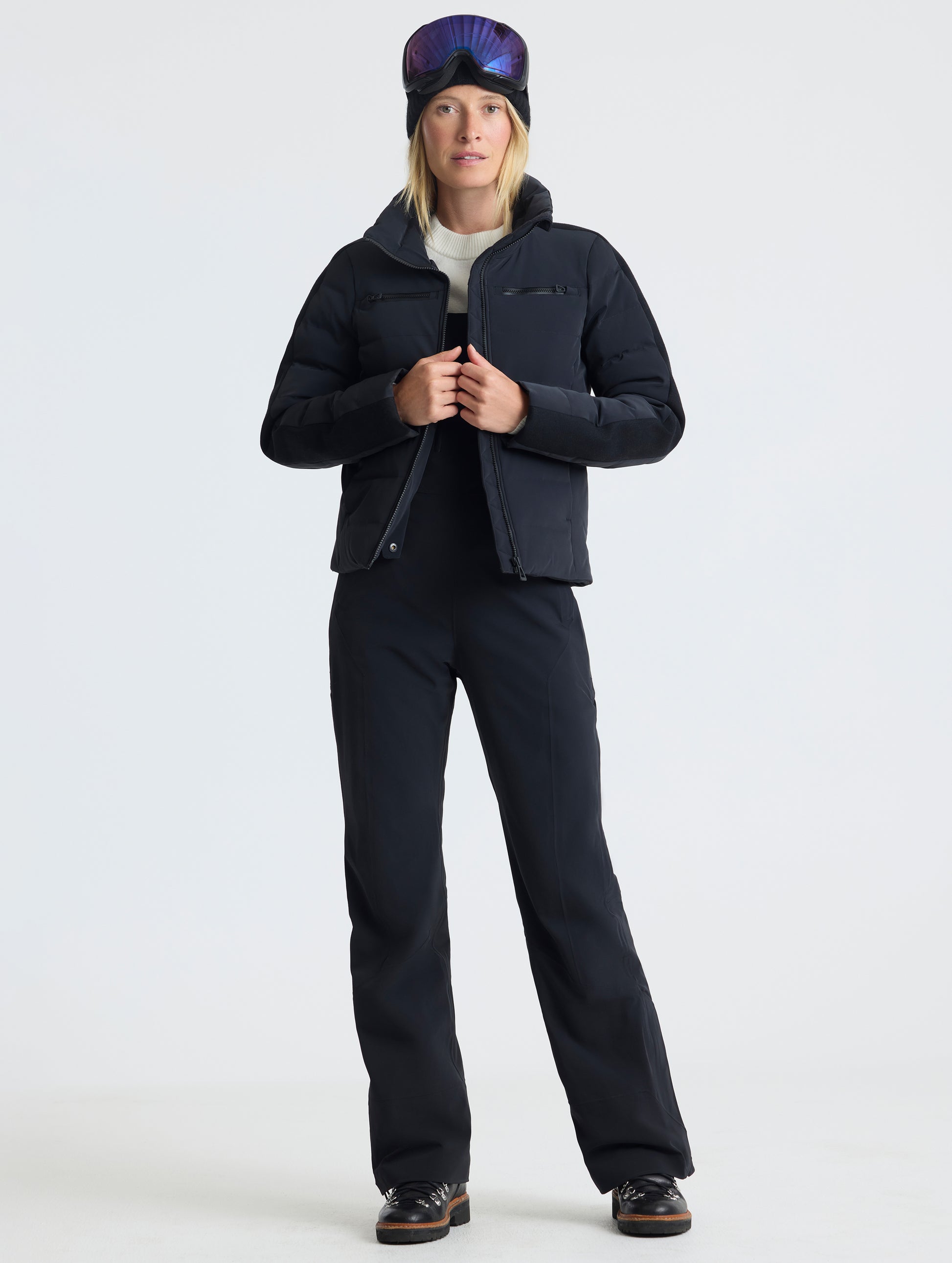 Front full-body view of woman wearing unzipped Nordic Jacket 2.0 in Onyx Black from AETHER Apparel.