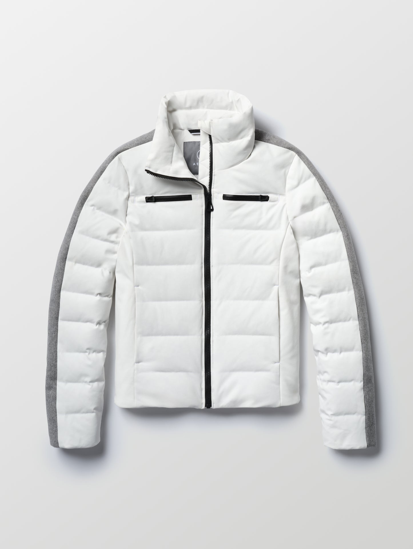 Flat lay of the Nordic Jacket 2.0 in Winter White from AETHER Apparel.