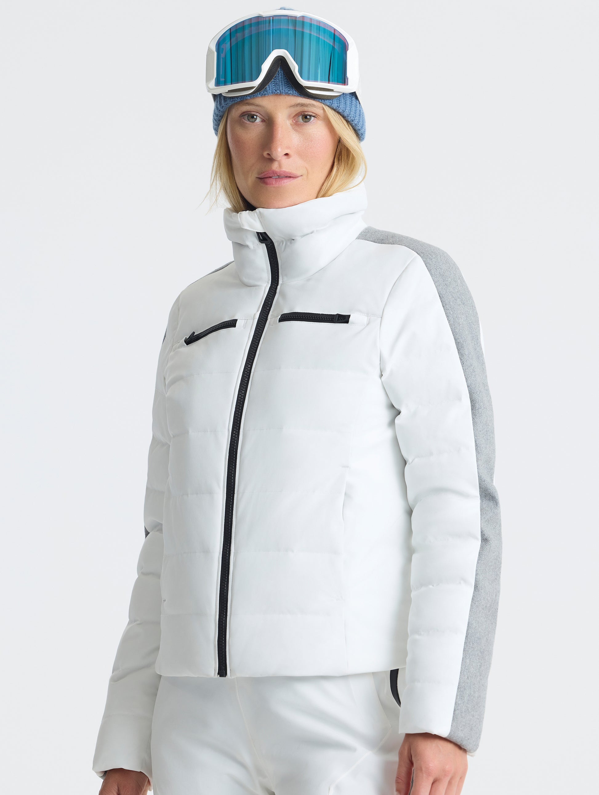 Front upper-body view of woman wearing the Nordic Jacket 2.0 in Winter White from AETHER Apparel.