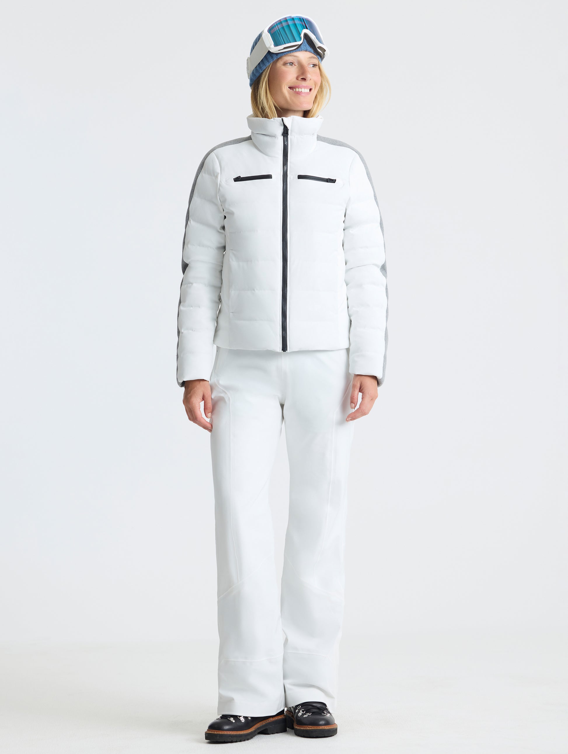 Front full-body view of woman wearing the Nordic Jacket 2.0 in Winter White from AETHER Apparel.