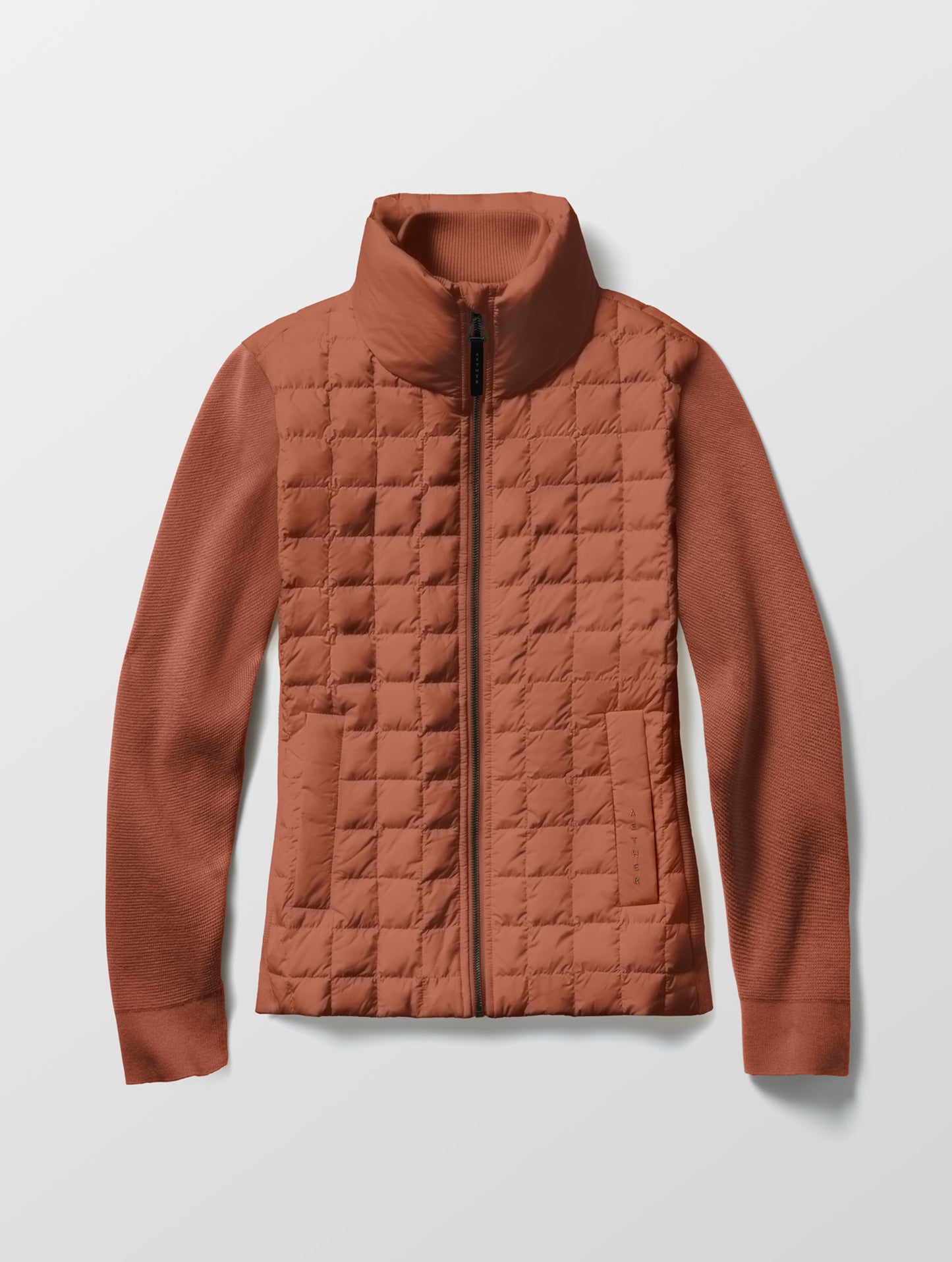 Flat lay of the Phase Full-Zip in Redwood Rust from AETHER Apparel.