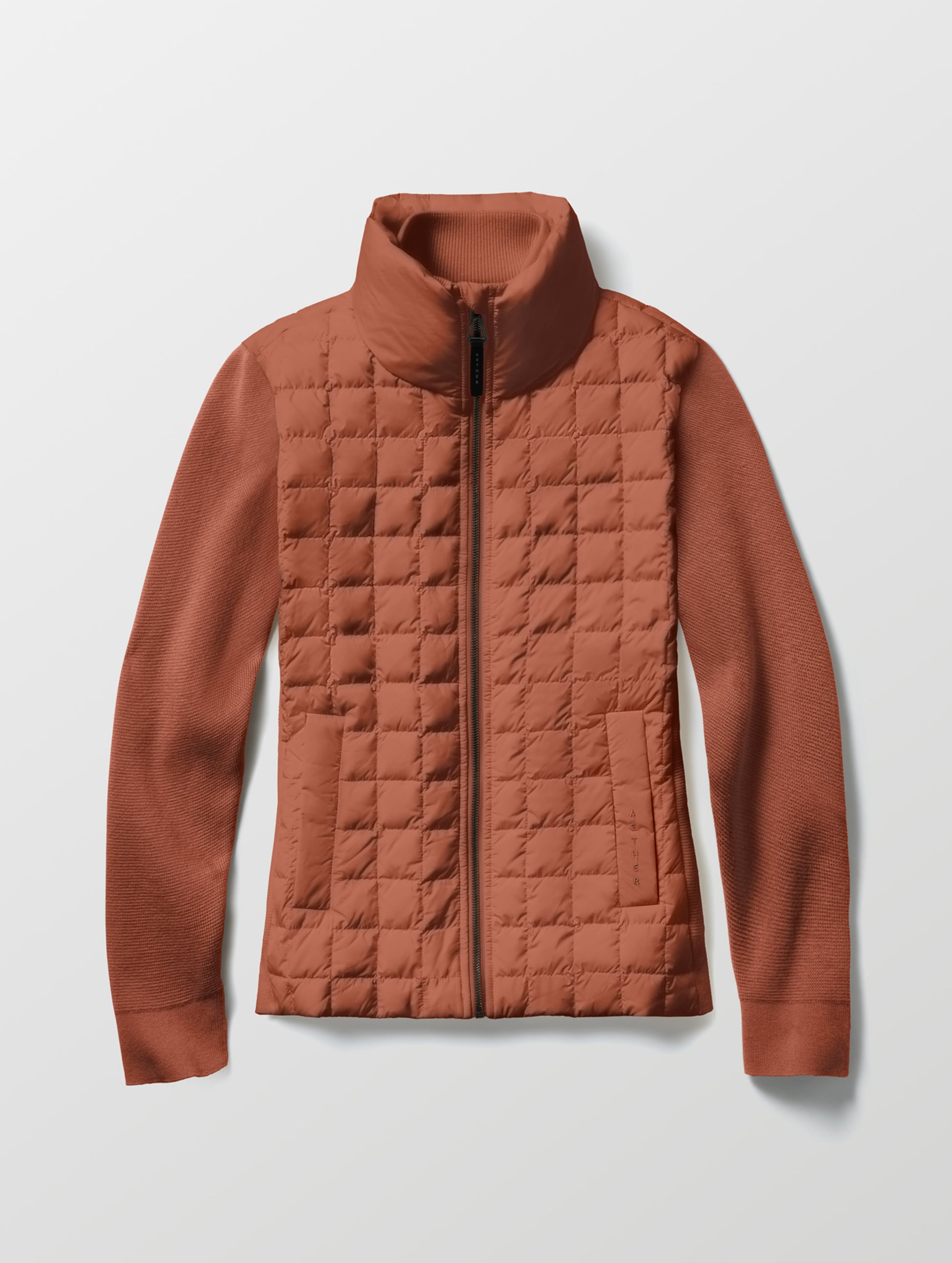 Flat lay of the Phase Full-Zip in Redwood Rust from AETHER Apparel.