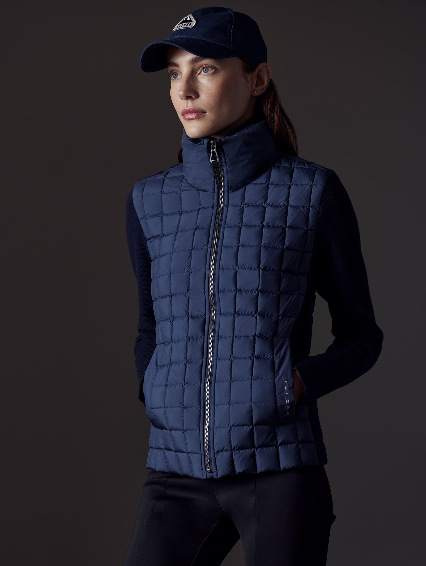 woman wearing blue insulated jacket from AETHER Apparel