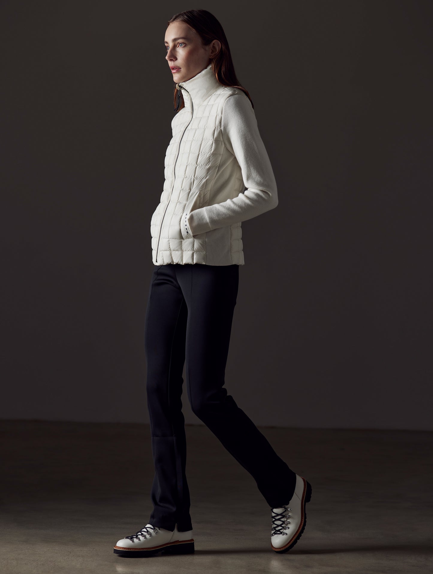 woman wearing white insulated jacket from AETHER Apparel