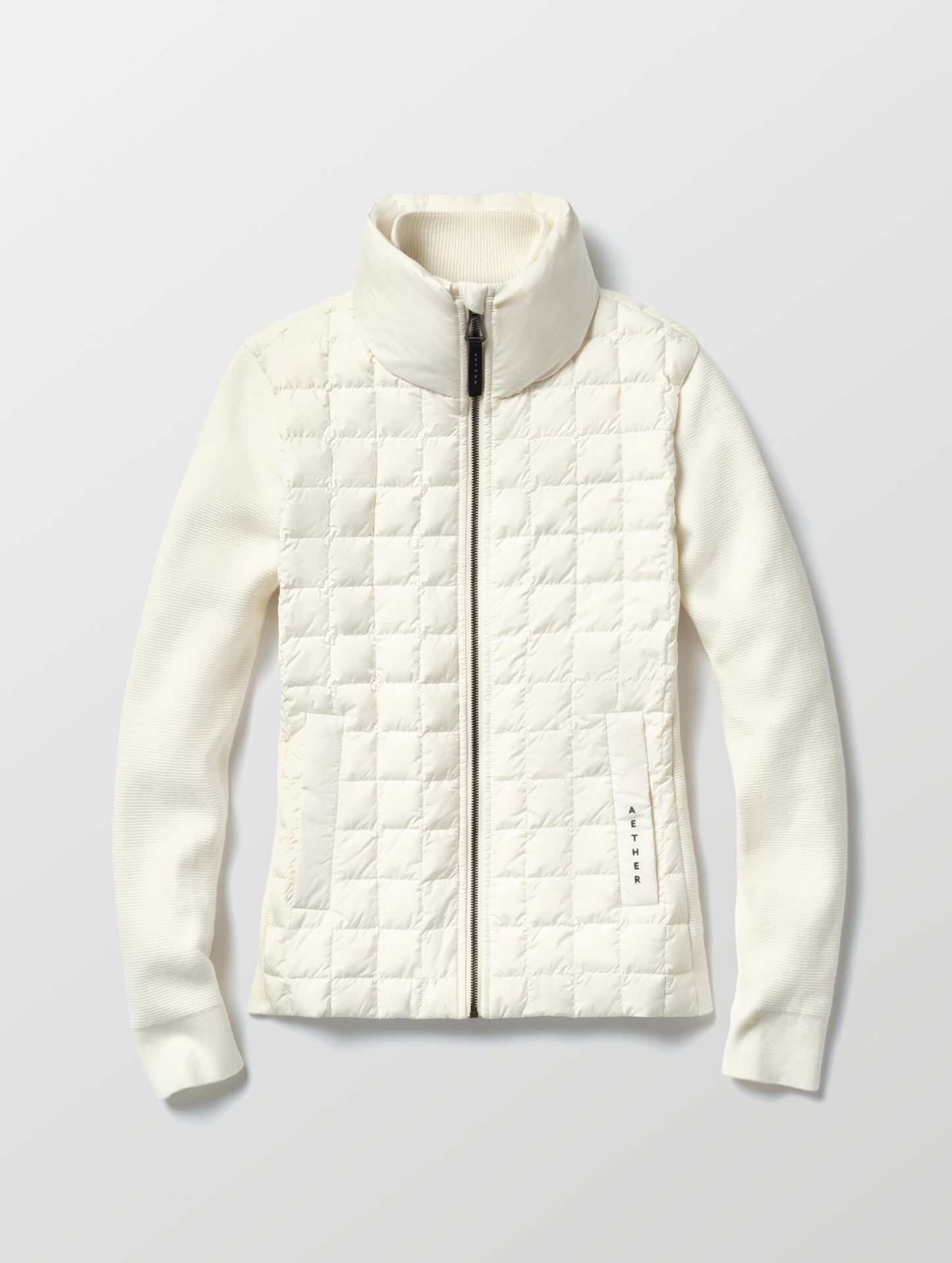 Flat lay of the Phase Full-Zip in Winter White from AETHER Apparel.