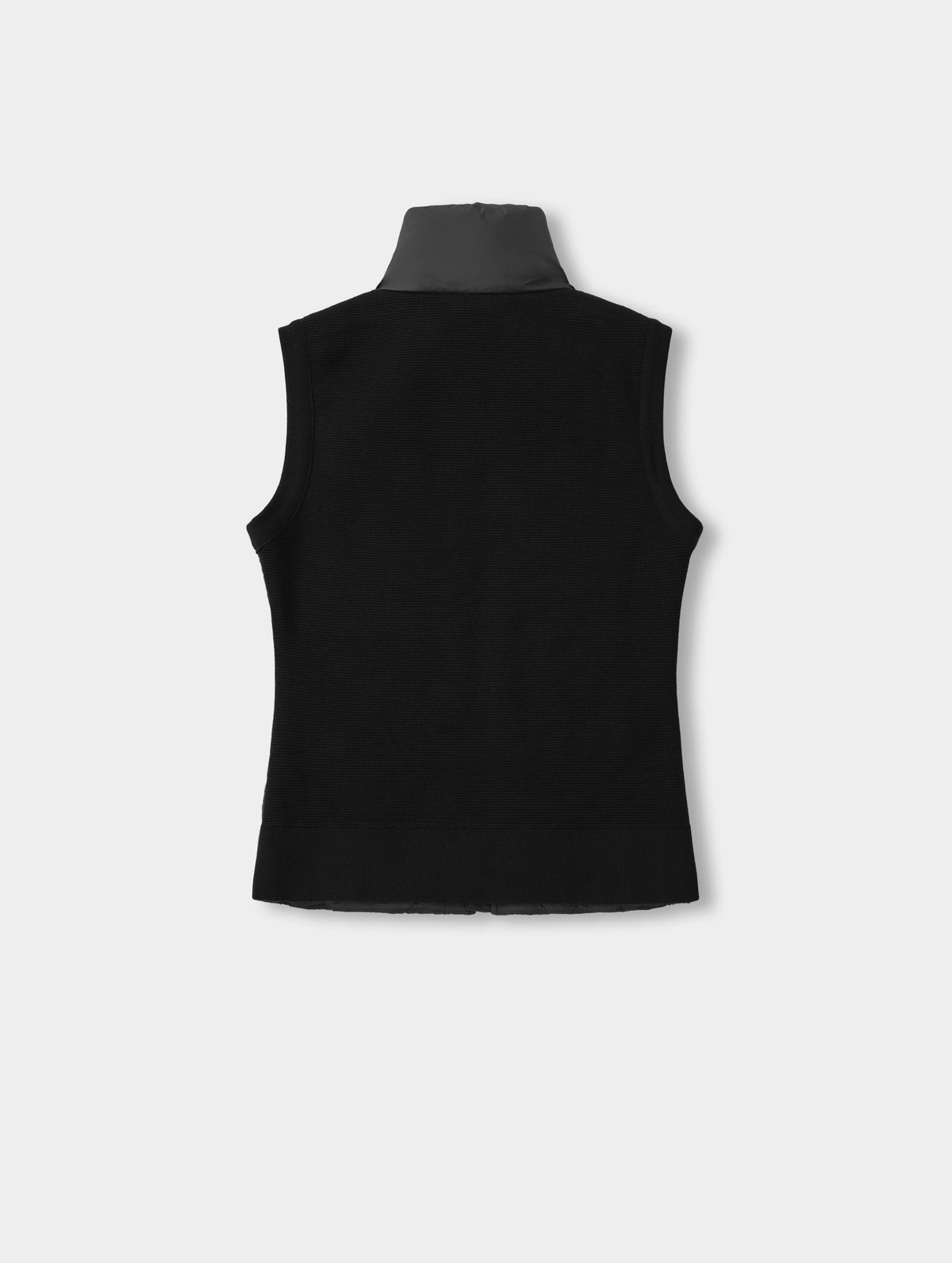Flat lay view of the back of the Phase Vest in Onyx Black from AETHER Apparel.