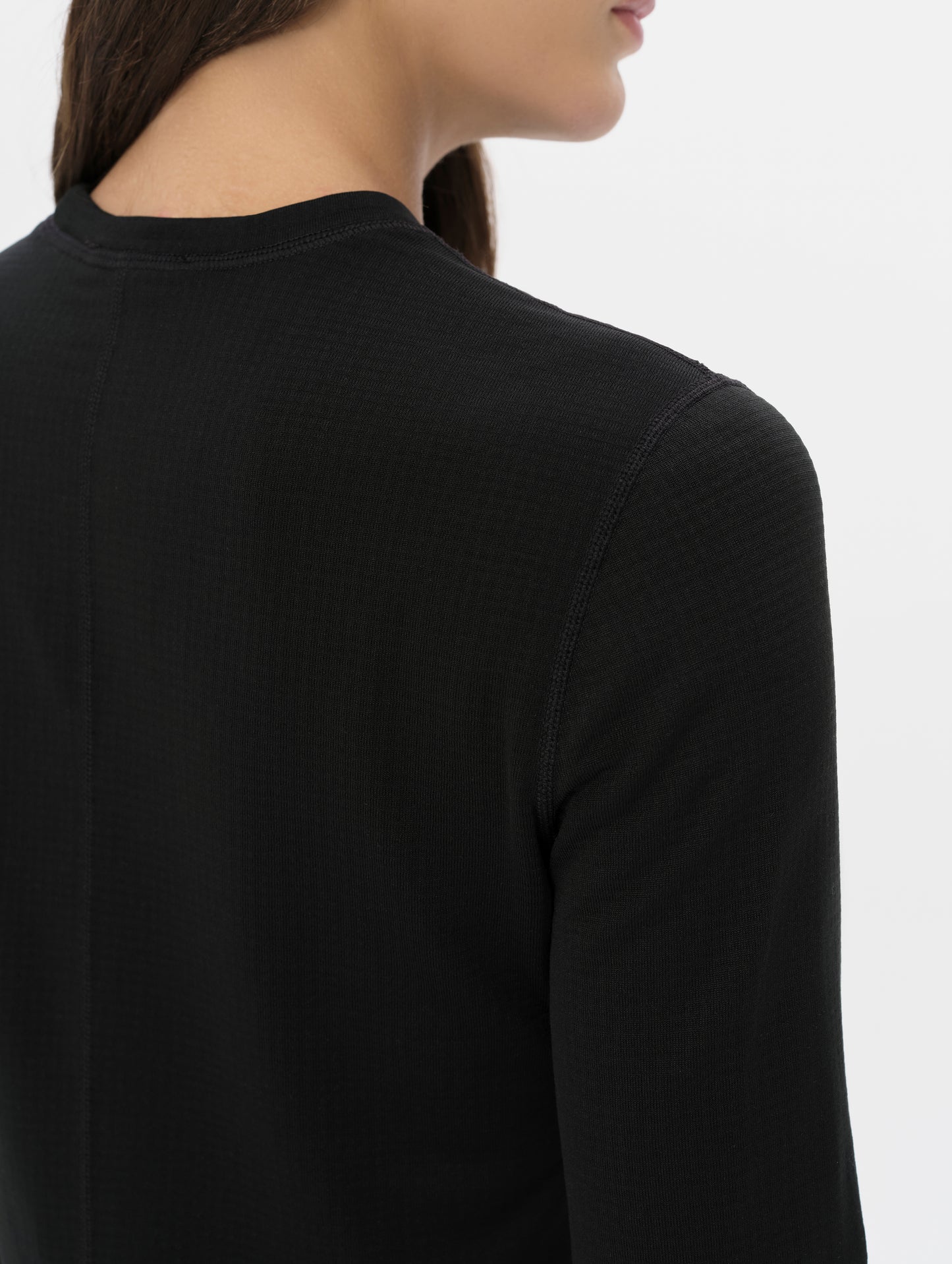 Closeup detailed view of the shoulder on the Polar Base Layer Crew in Onyx Black from AETHER Apparel.