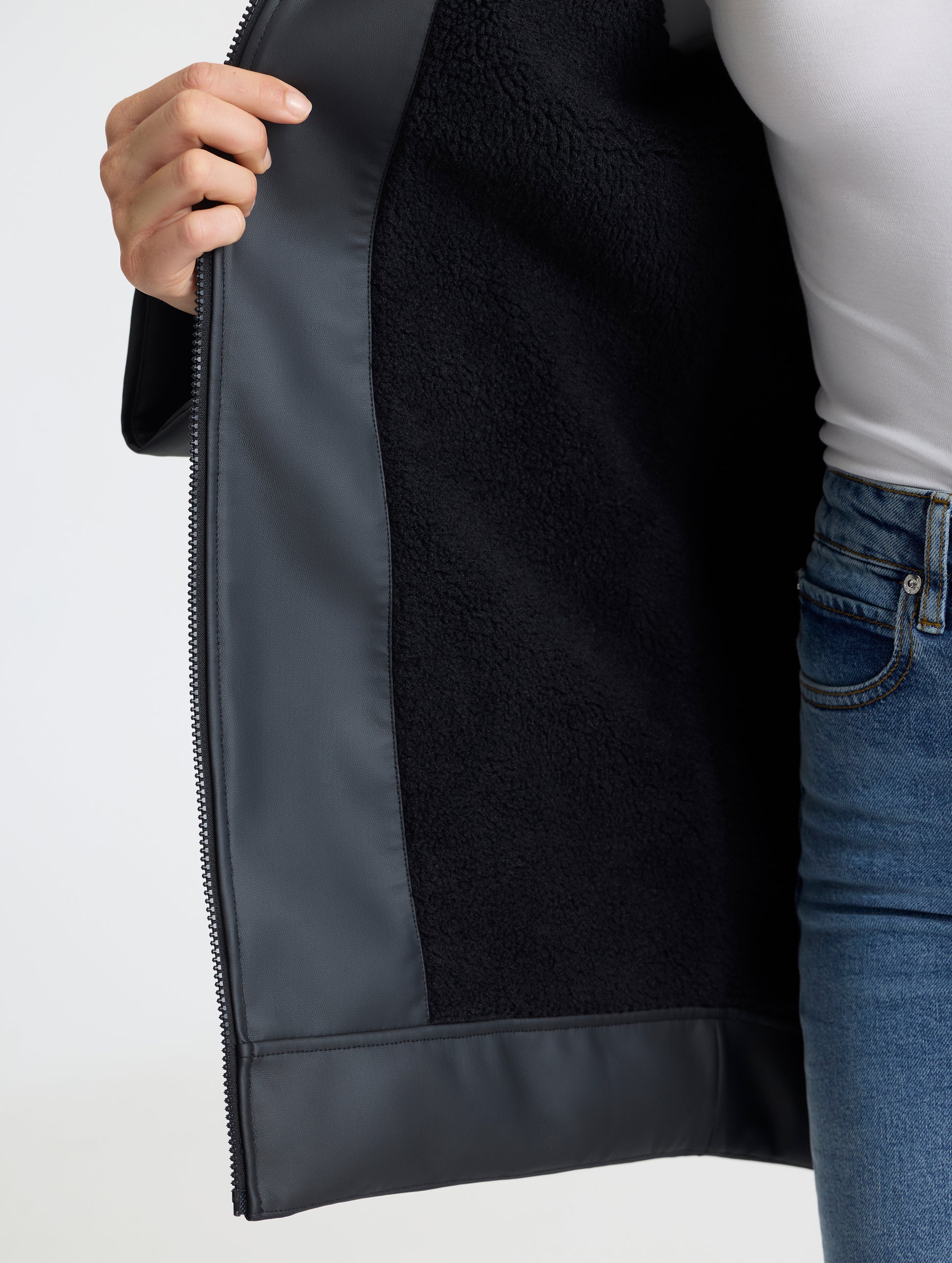 Closeup detailed view of the sherpa lining on the Quest Sherpa-Lined Rain Jacket Onyx Black from AETHER Apparel. 