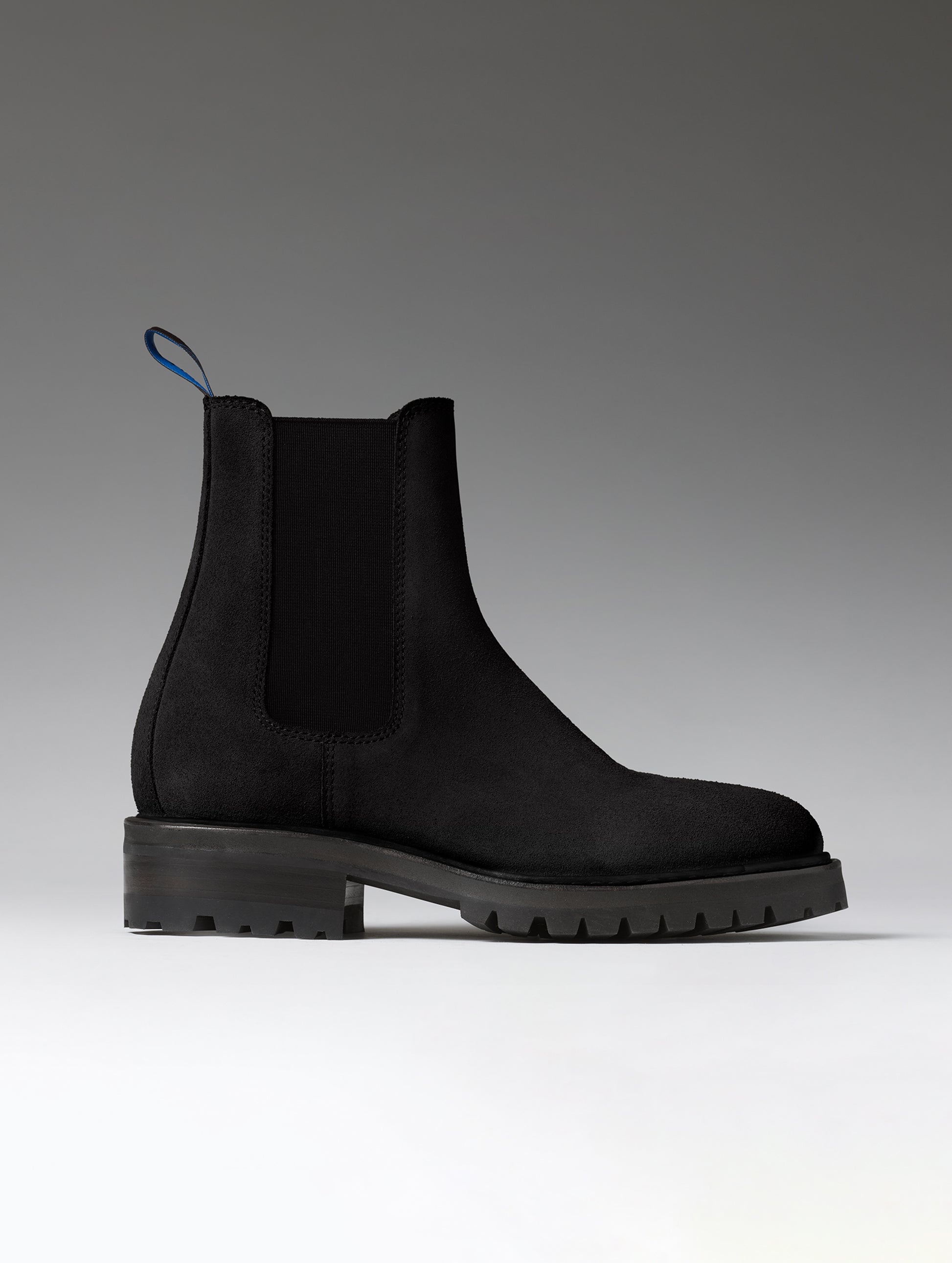 Side profile view of the Reign Chelsea Boot in Onyx Black from AETHER Apparel.