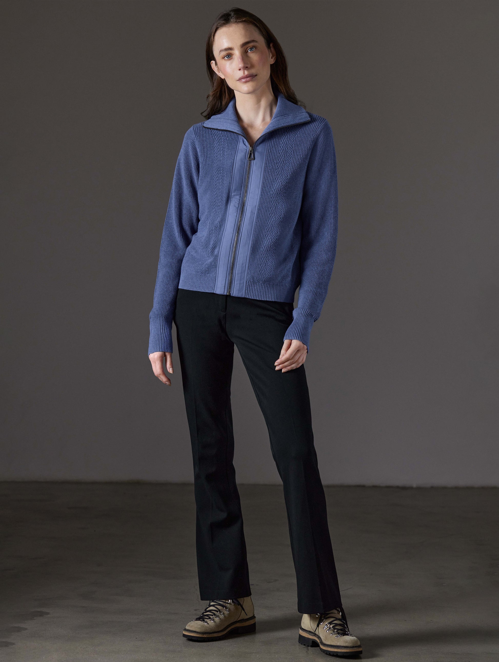 Front full-body view of woman wearing Rhea Full-Zip Sweater in Portal Blue Heather from AETHER Apparel.