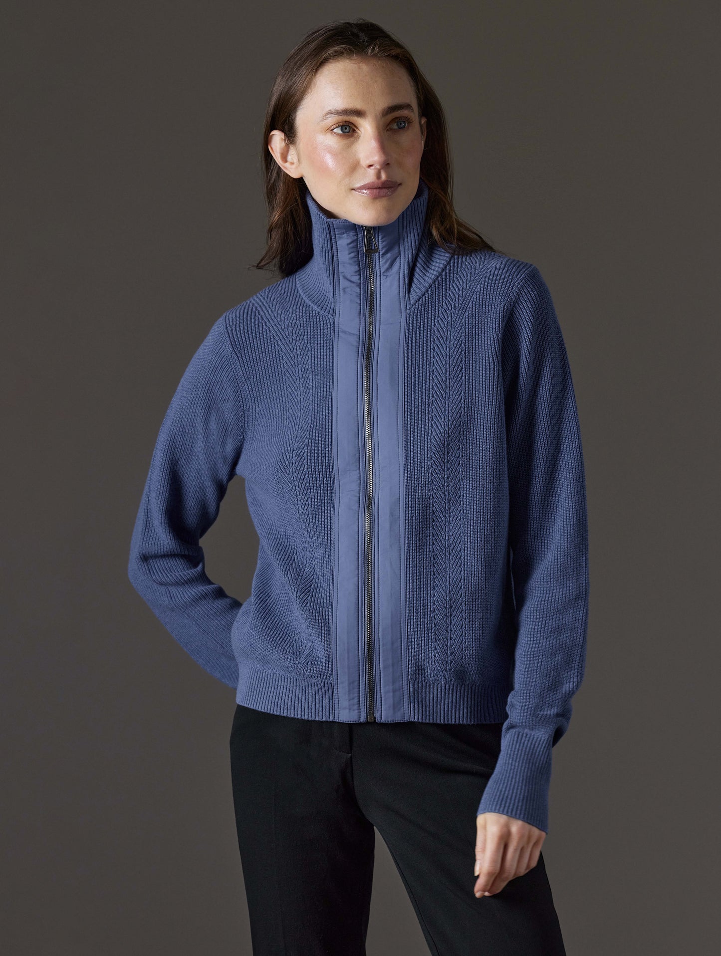 Front view of woman wearing Rhea Full-Zip Sweater in Portal Blue Heather from AETHER Apparel.