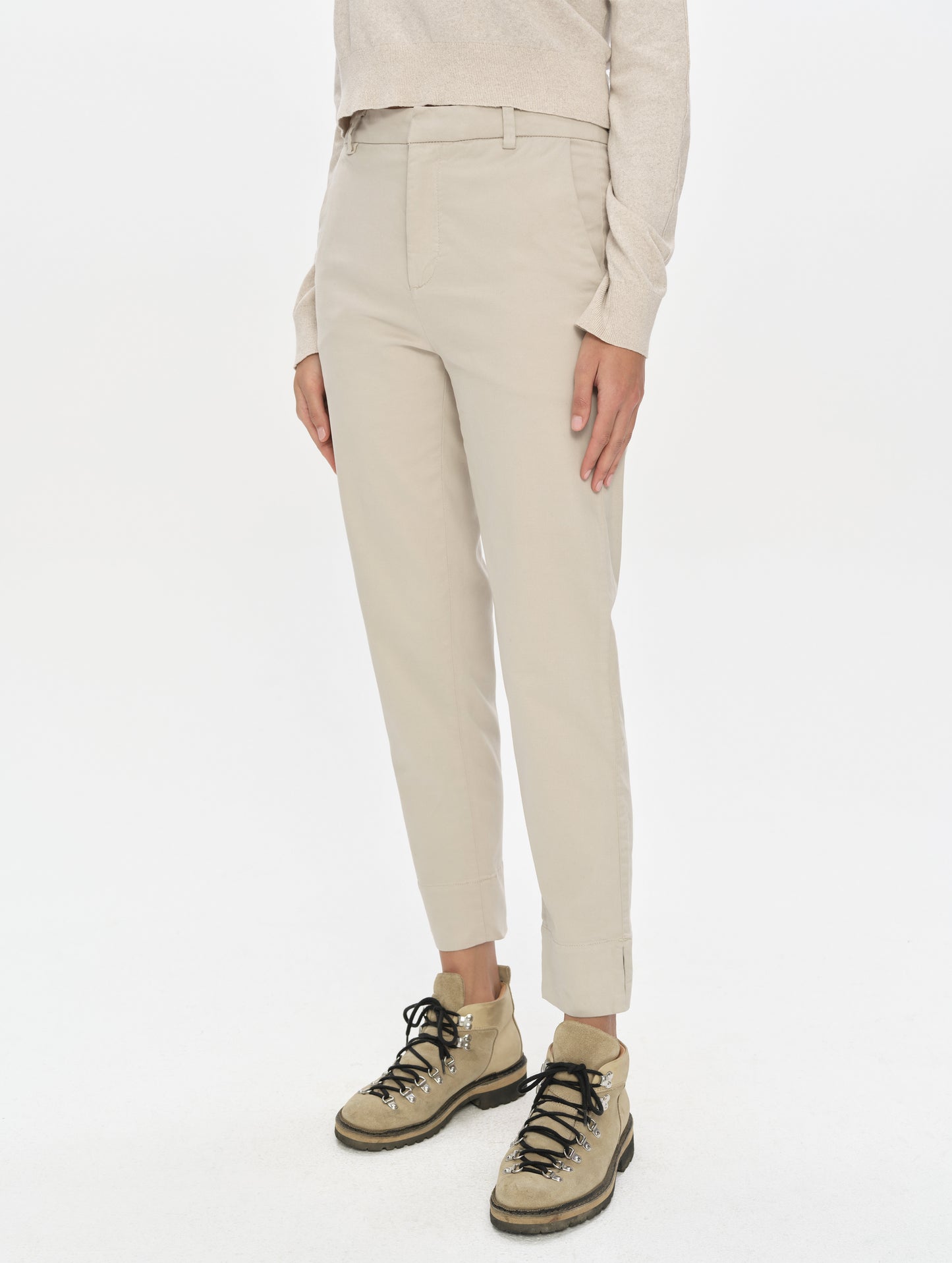 Front, 3/4, lower-body view of woman wearing the Rhy Straight Leg Pant in Bone from AETHER Apparel.
