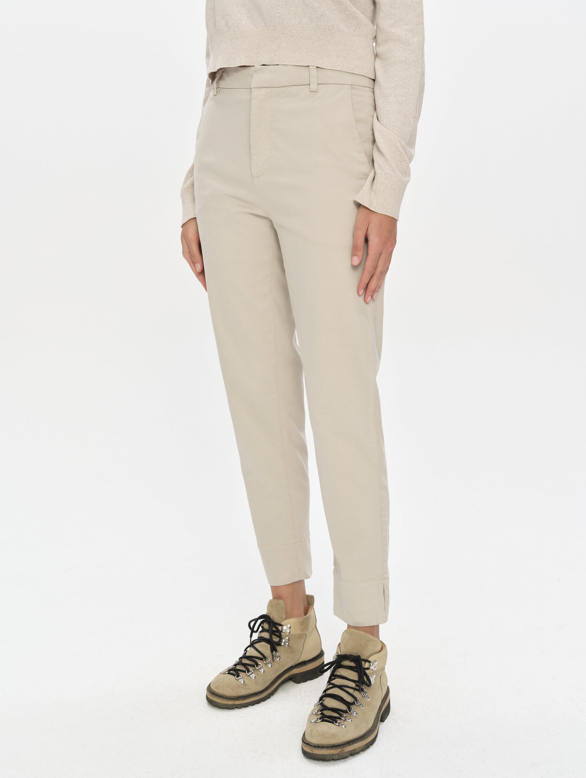 Front, 3/4, lower-body view of woman wearing the Rhy Straight Leg Pant in Bone from AETHER Apparel.