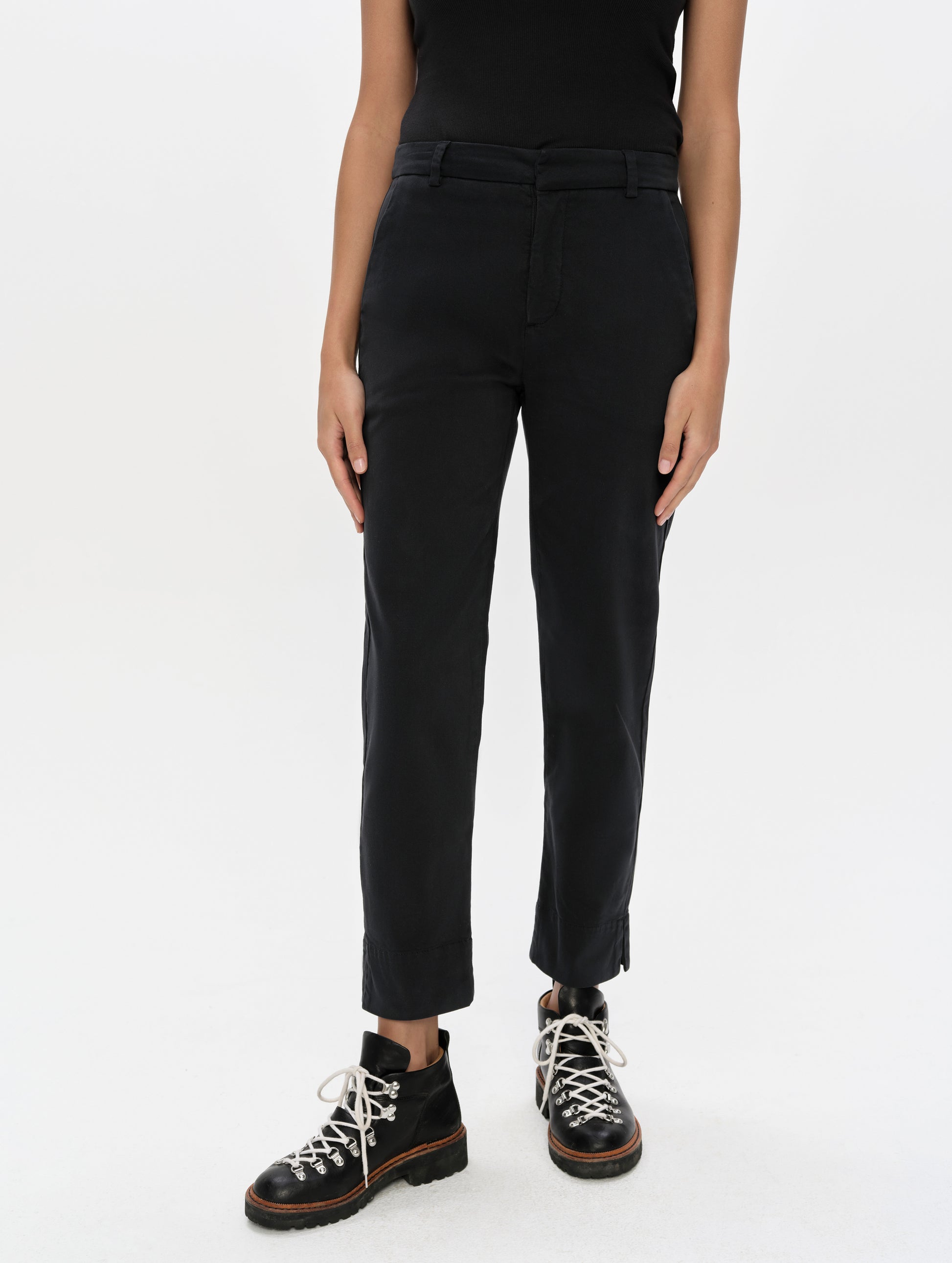 Front, lower-body view of woman wearing the Rhy Straight Leg Pant in Onyx Black from AETHER Apparel.