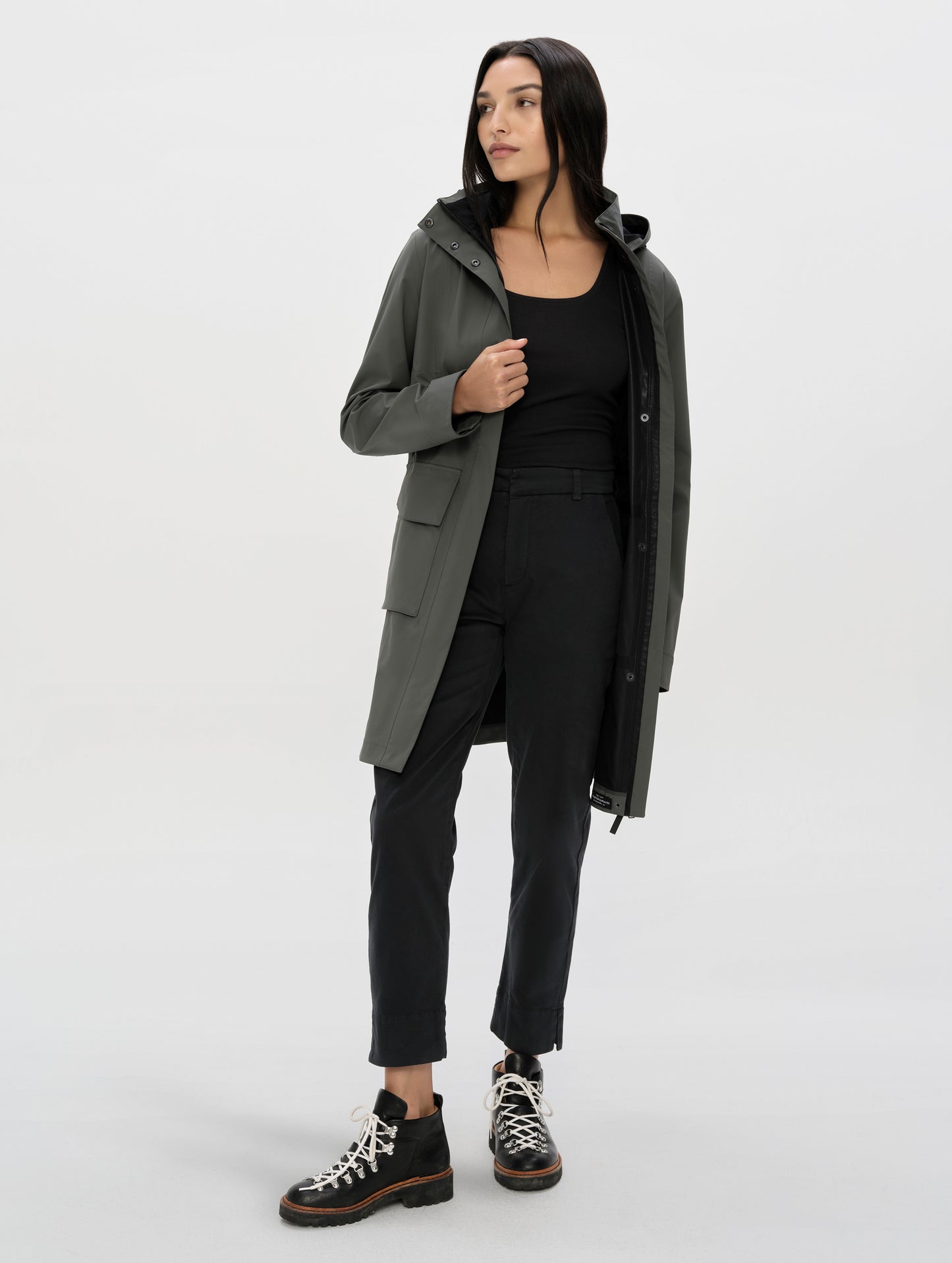 Front, full-body view of woman wearing the Rhy Straight Leg Pant in Onyx Black from AETHER Apparel.