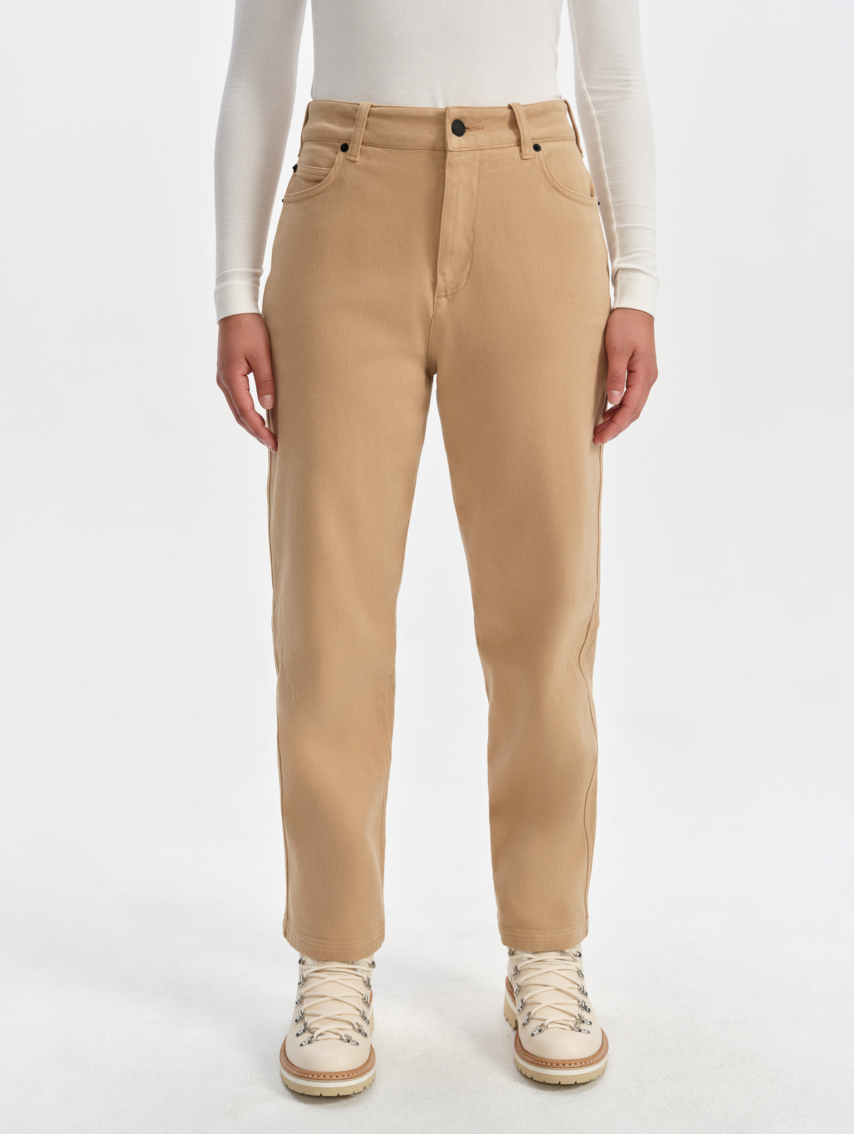 Front lower-body view of woman wearing the Rowan Cotton Pant in Latte Brown from AETHER Apparel.