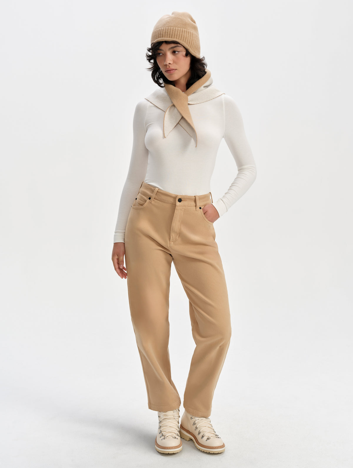 Front full-body view of woman wearing the Rowan Cotton Pant in Latte Brown from AETHER Apparel.