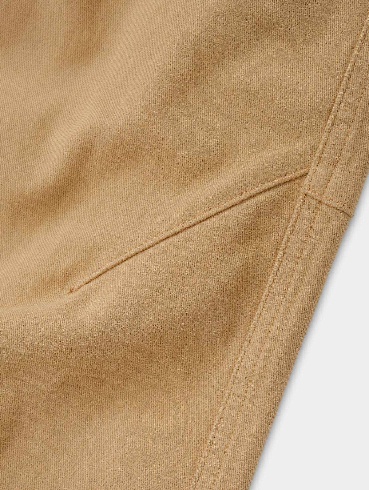 Closeup detailed view of the mobility-bolstering knee darts on the Rowan Cotton Pant in Latte Brown from AETHER Apparel.