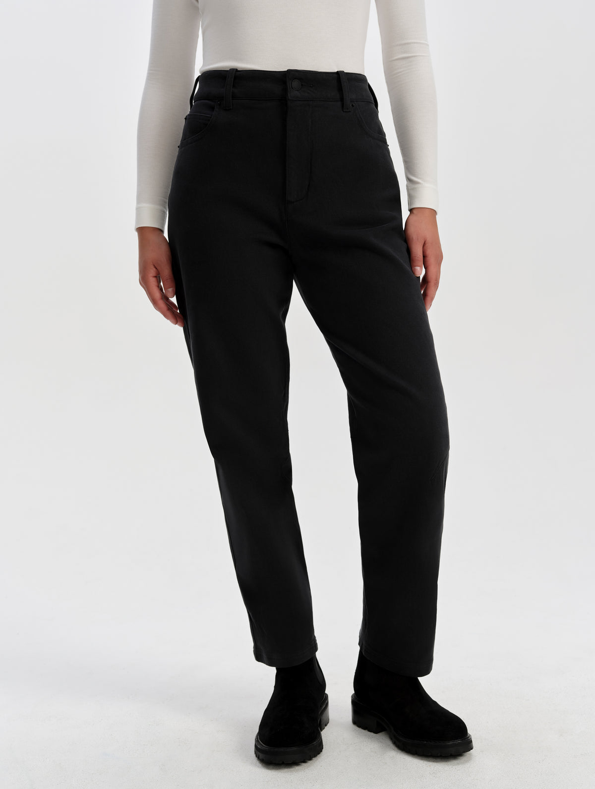Front lower-body view of woman wearing the Rowan Cotton Pant in Onyx Black from AETHER Apparel.