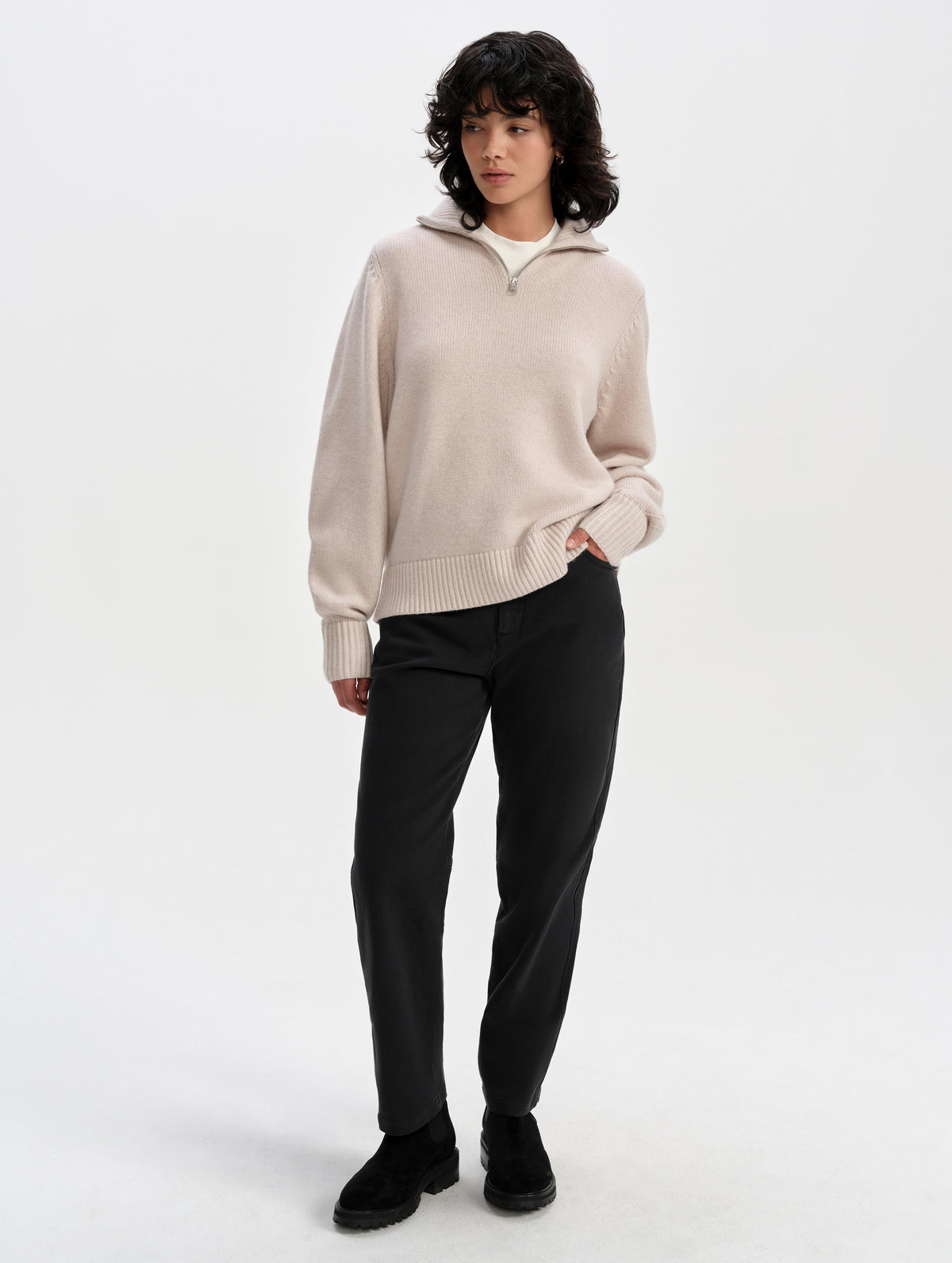 Front full-body view of woman wearing the Rowan Cotton Pant in Onyx Black from AETHER Apparel.