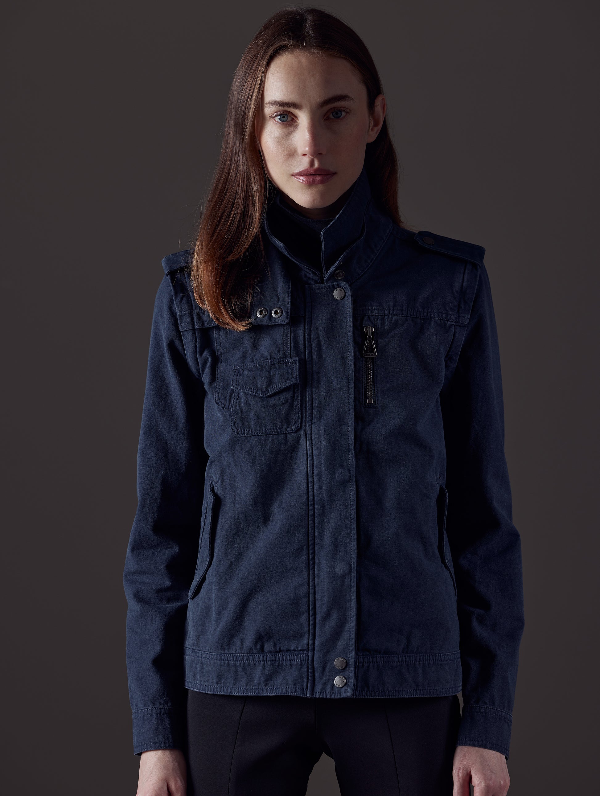 Woman wearing blue jacket from AETHER Apparel