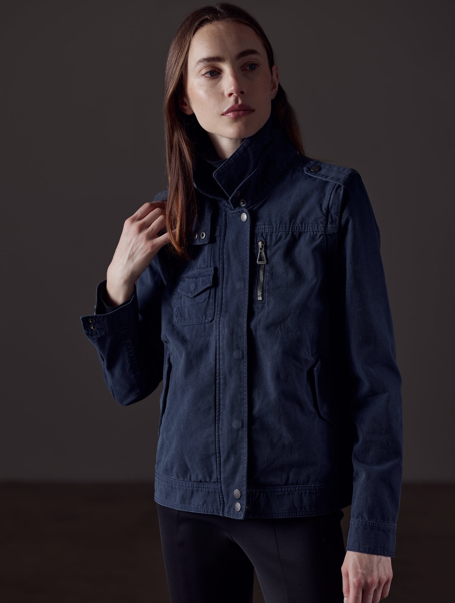 Woman wearing blue jacket from AETHER Apparel