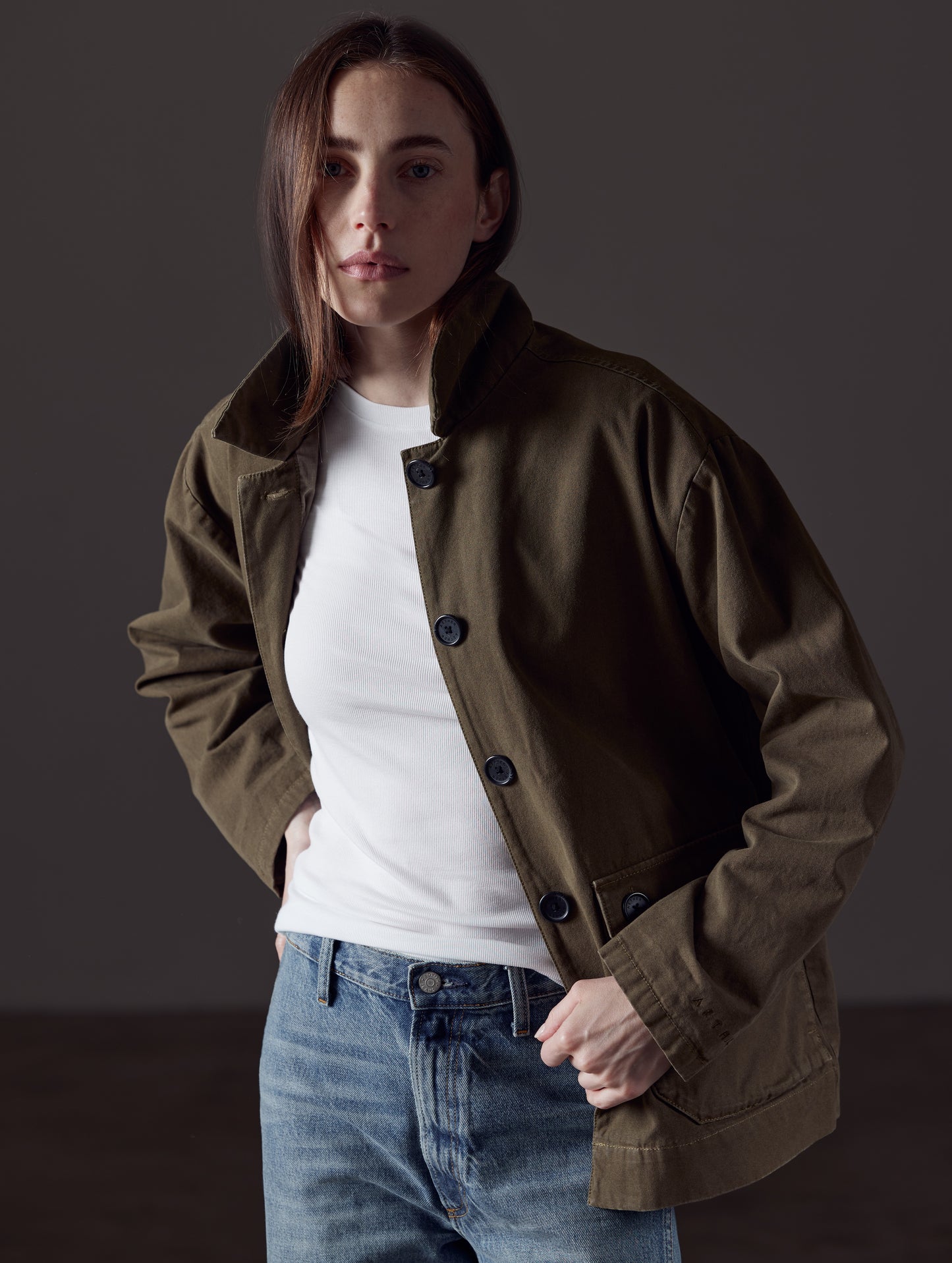 Woman wearing green button-up jacket from AETHER Apparel 