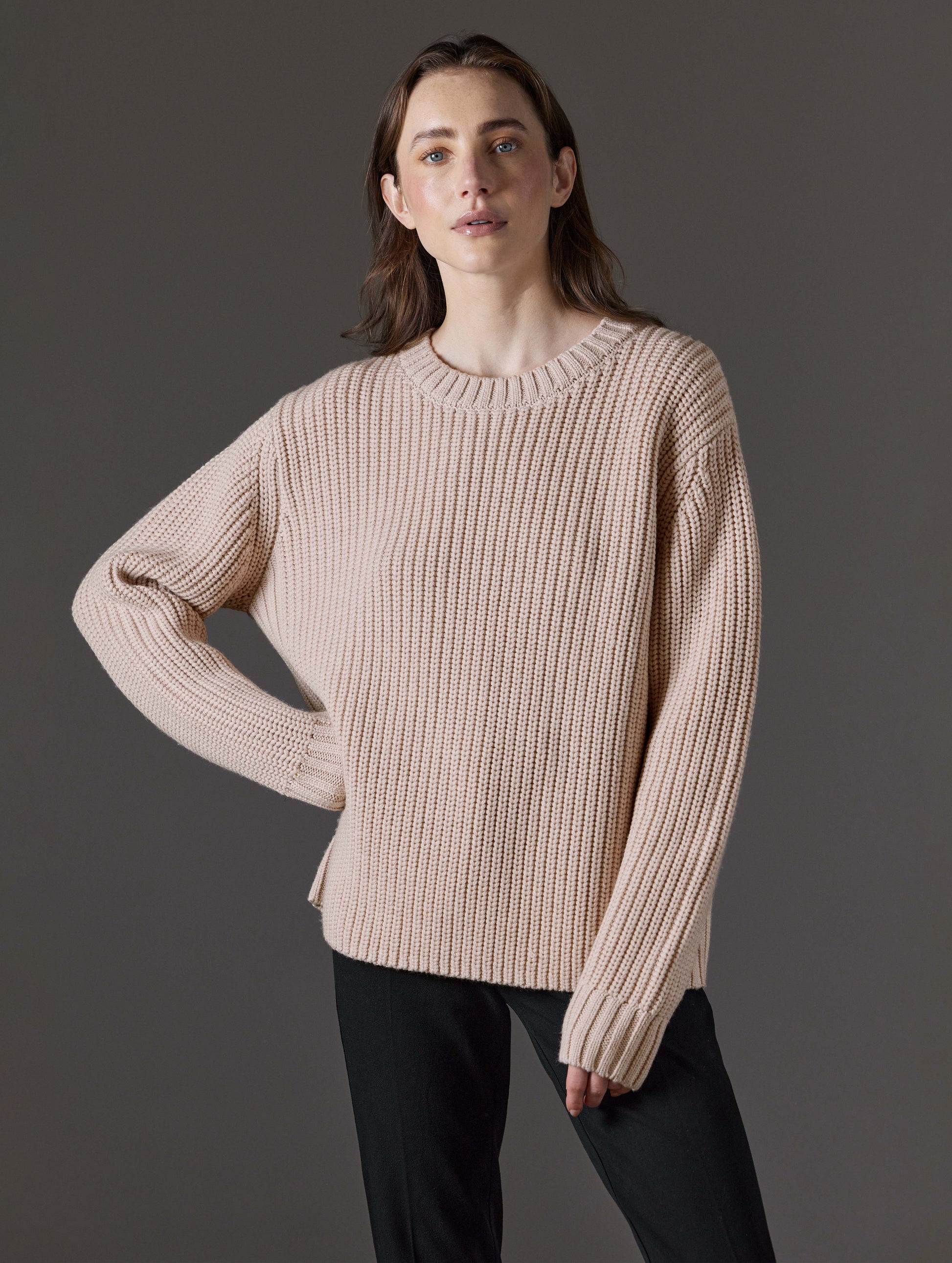 Front view of woman wearing Sherwood Crewneck Sweater in Blush beige from AETHER Apparel.