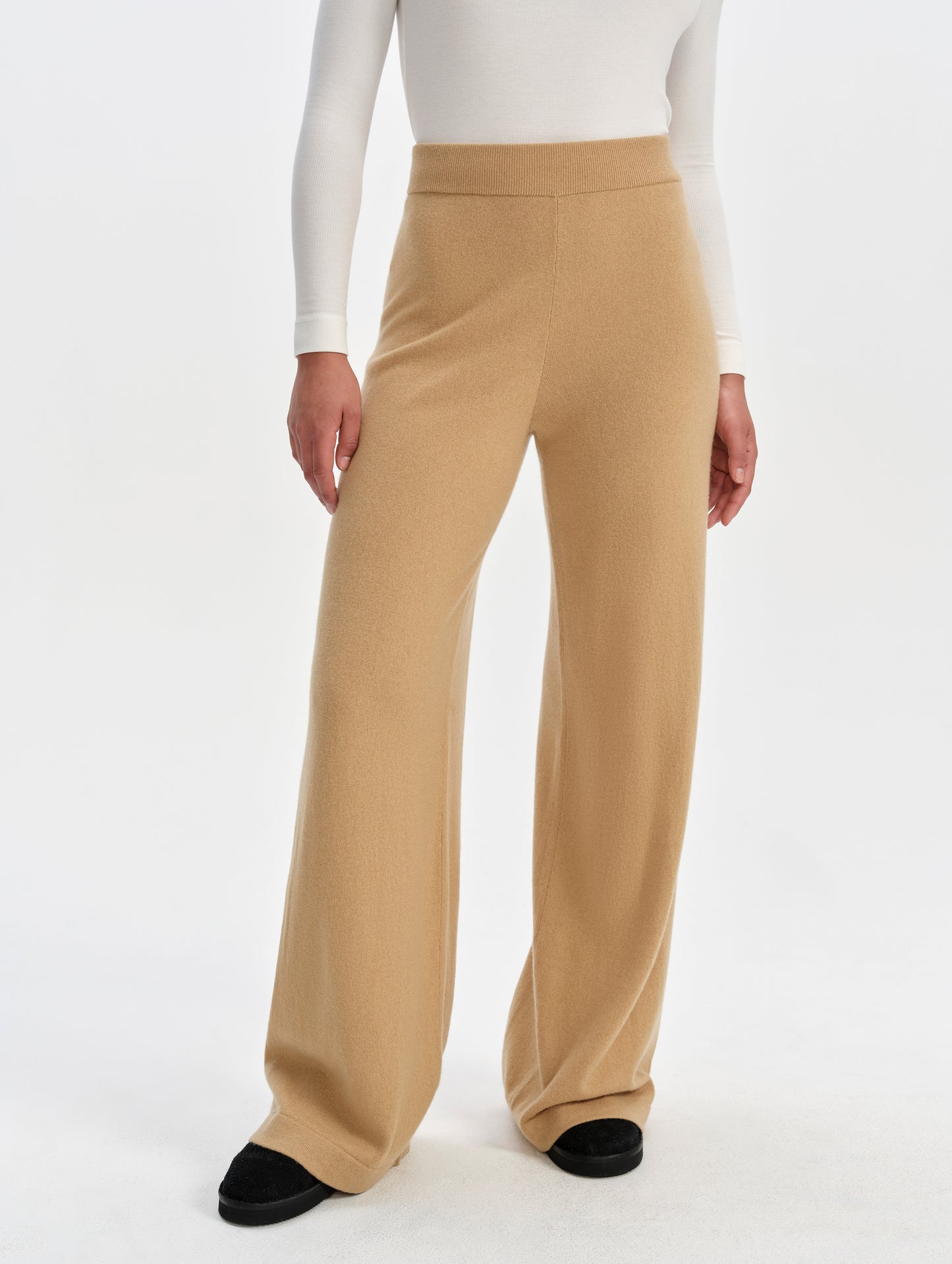 Front lower-body view of woman wearing the Solace Cashmere Pant in Latte Brown from AETHER Apparel.