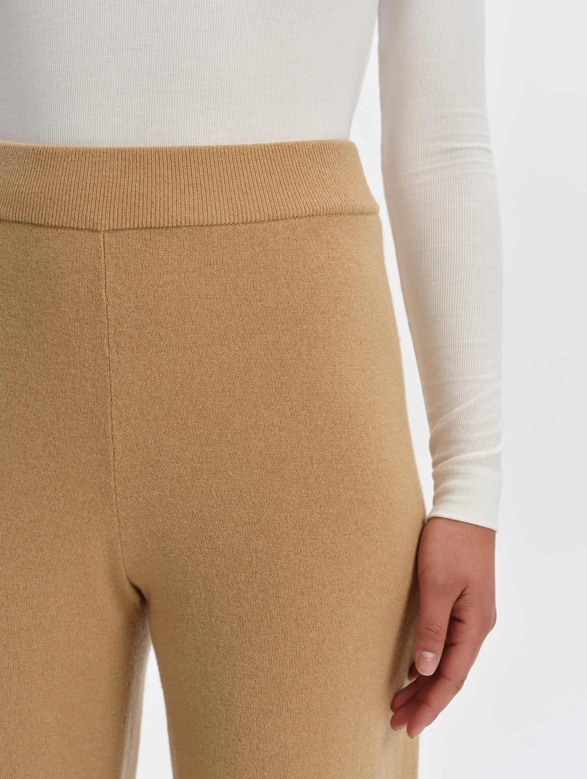 Closeup detailed view of the rib-knit waistband on the Solace Cashmere Pant in Latte Brown from AETHER Apparel.