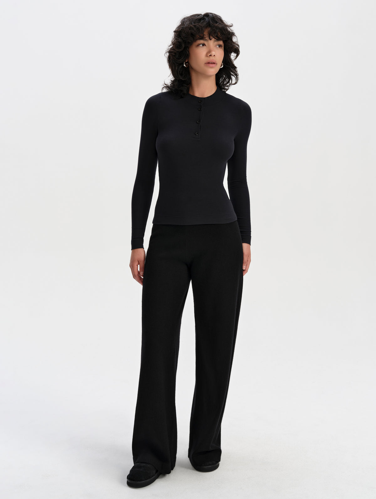 Front full-body view of woman wearing the Solace Cashmere Pant in Onyx Black from AETHER Apparel.