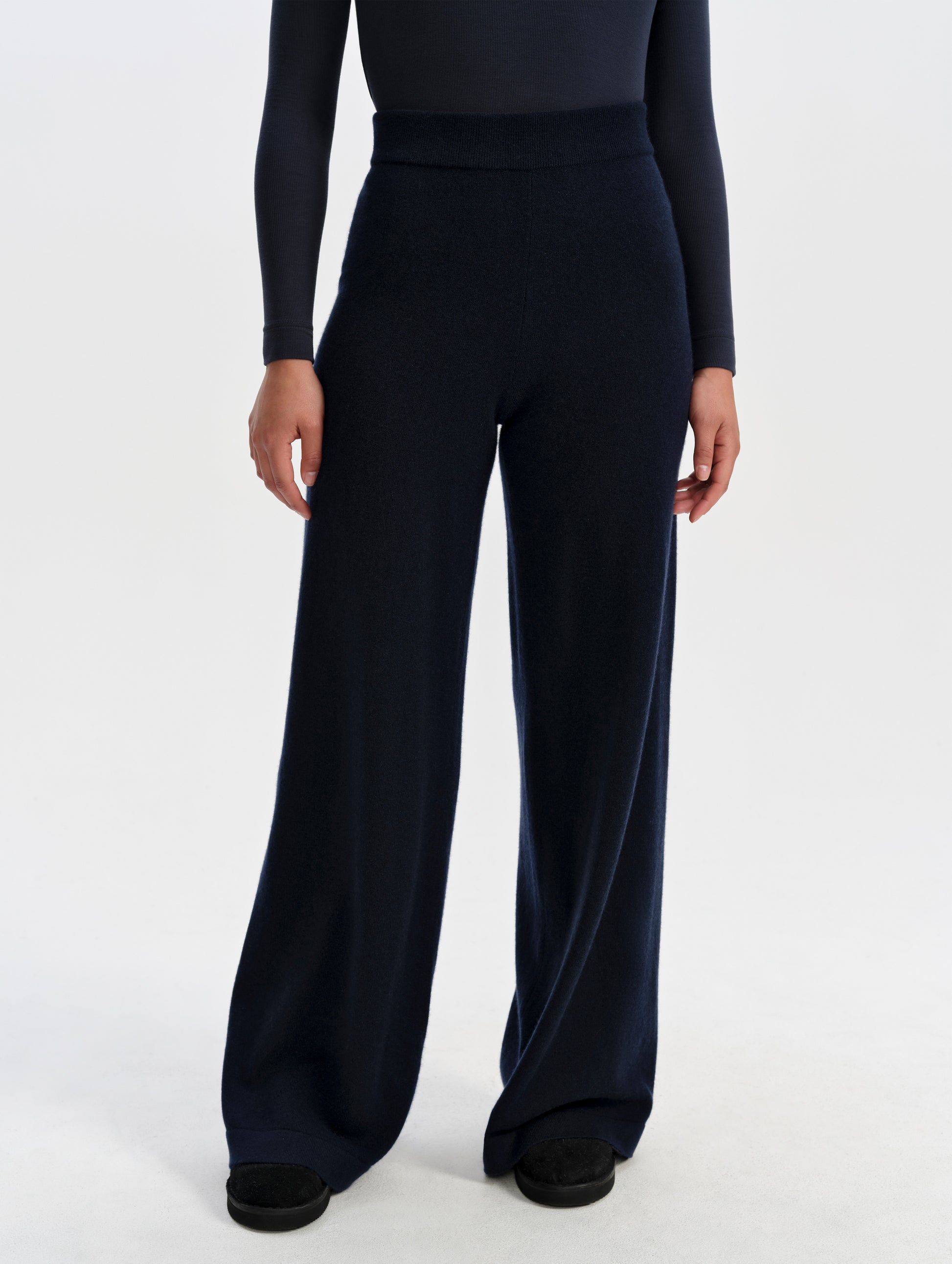 Front lower-body view of woman wearing the Solace Cashmere Pant in Total Eclipse from AETHER Apparel.