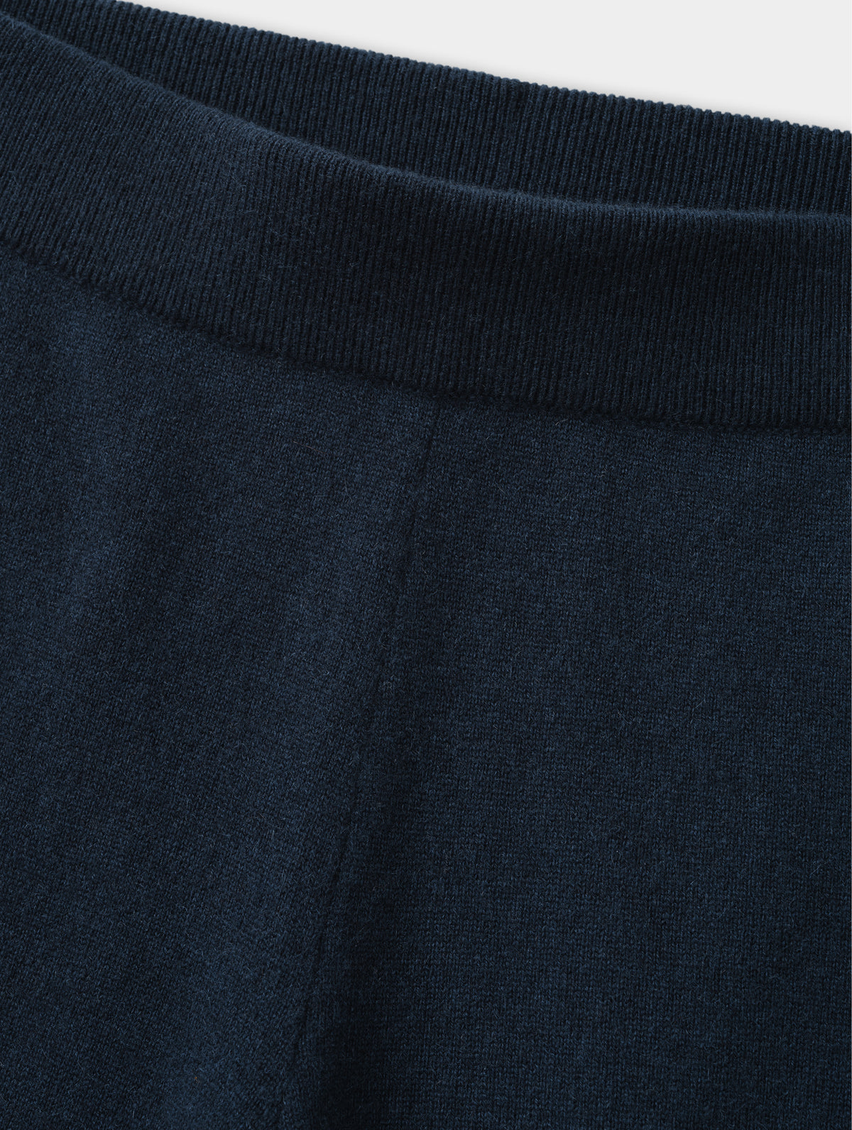 Closeup detailed view of the rib-knit waistband on the Solace Cashmere Pant in Total Eclipse from AETHER Apparel.