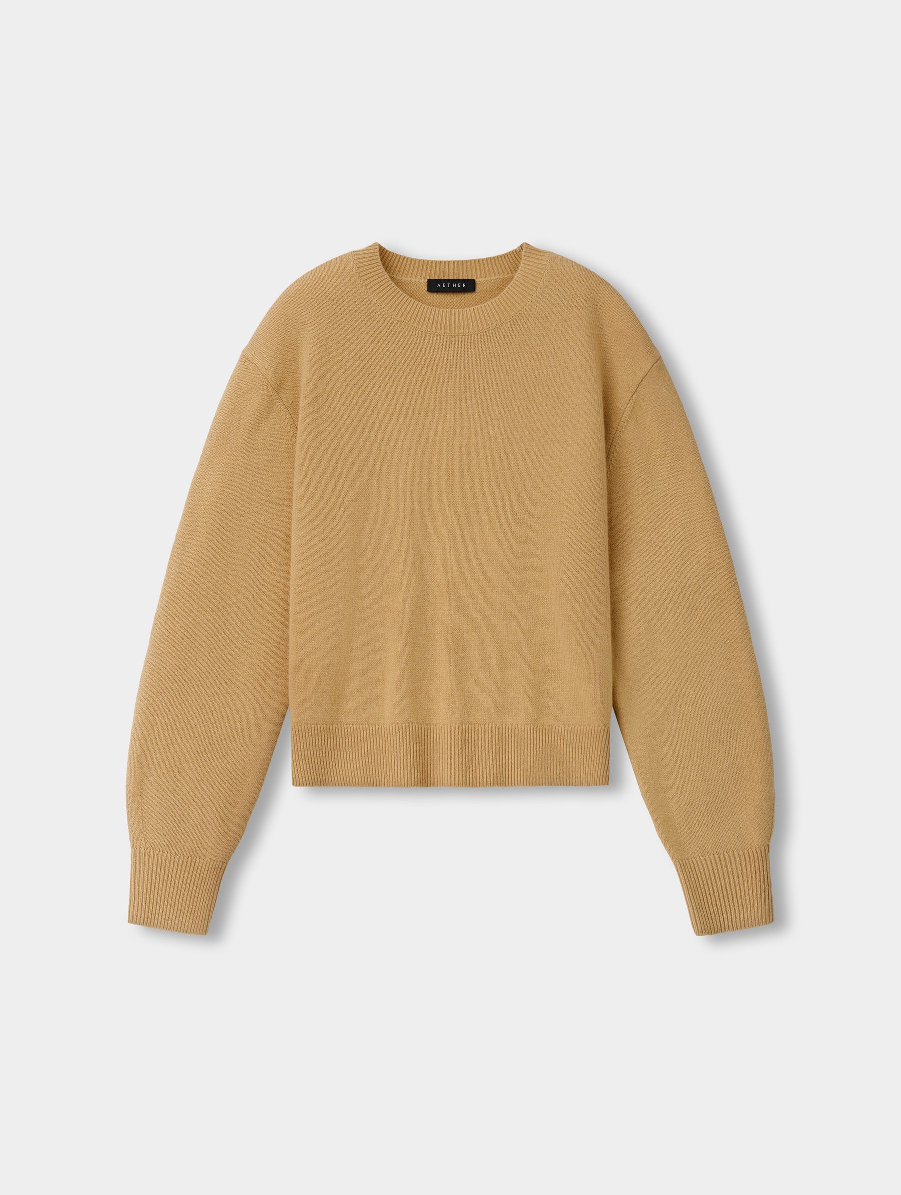 Flat lay view of the Solace Cashmere Sweater in Latte Brown from AETHER Apparel.