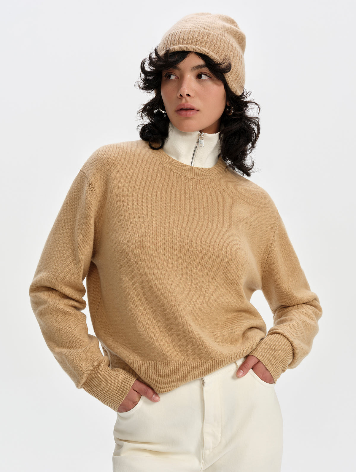 Front upper-body view of woman wearing the Solace Cashmere Sweater in Latte Brown from AETHER Apparel.