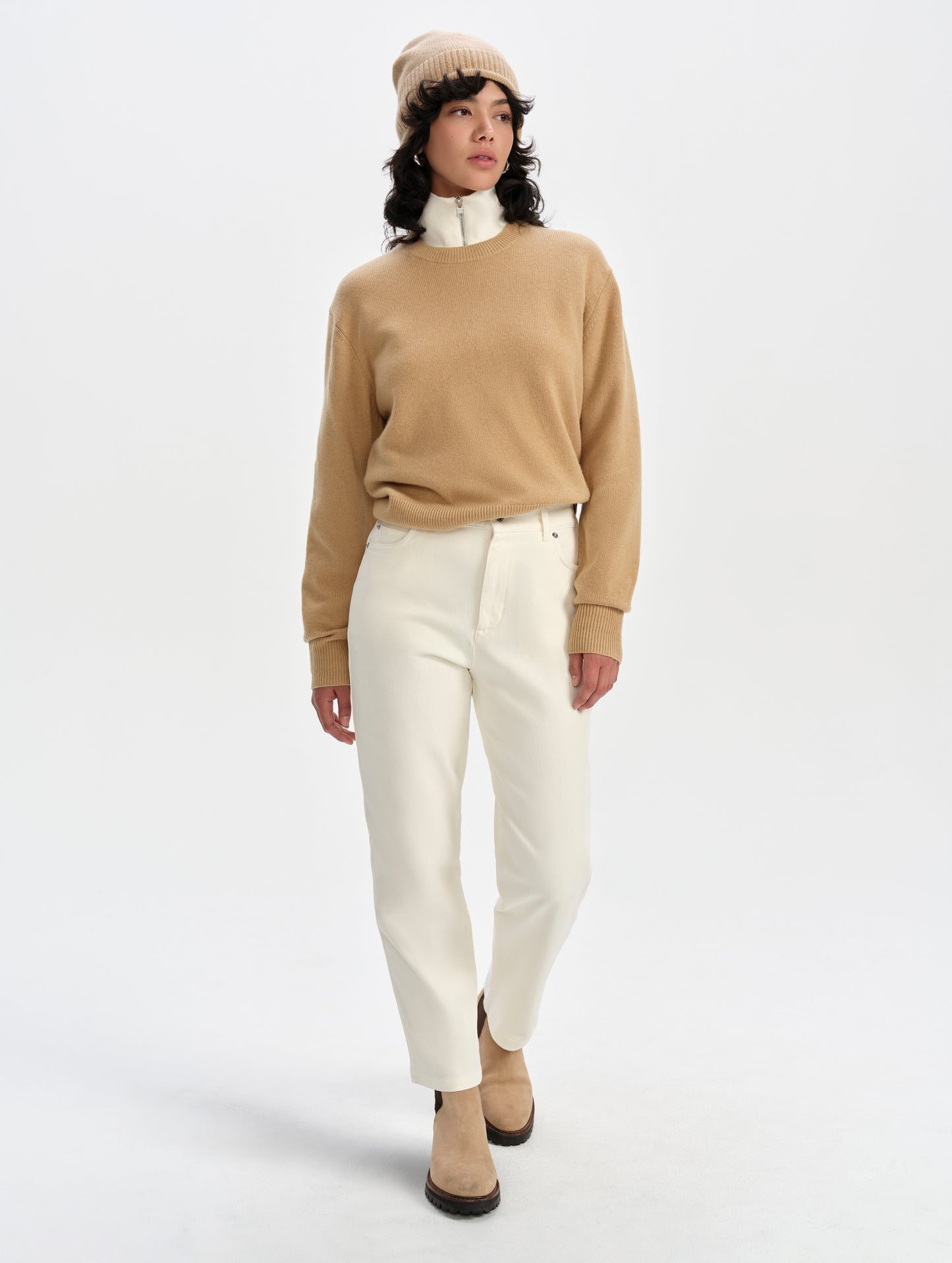 Front full-body view of woman wearing the Solace Cashmere Sweater in Latte Brown from AETHER Apparel.