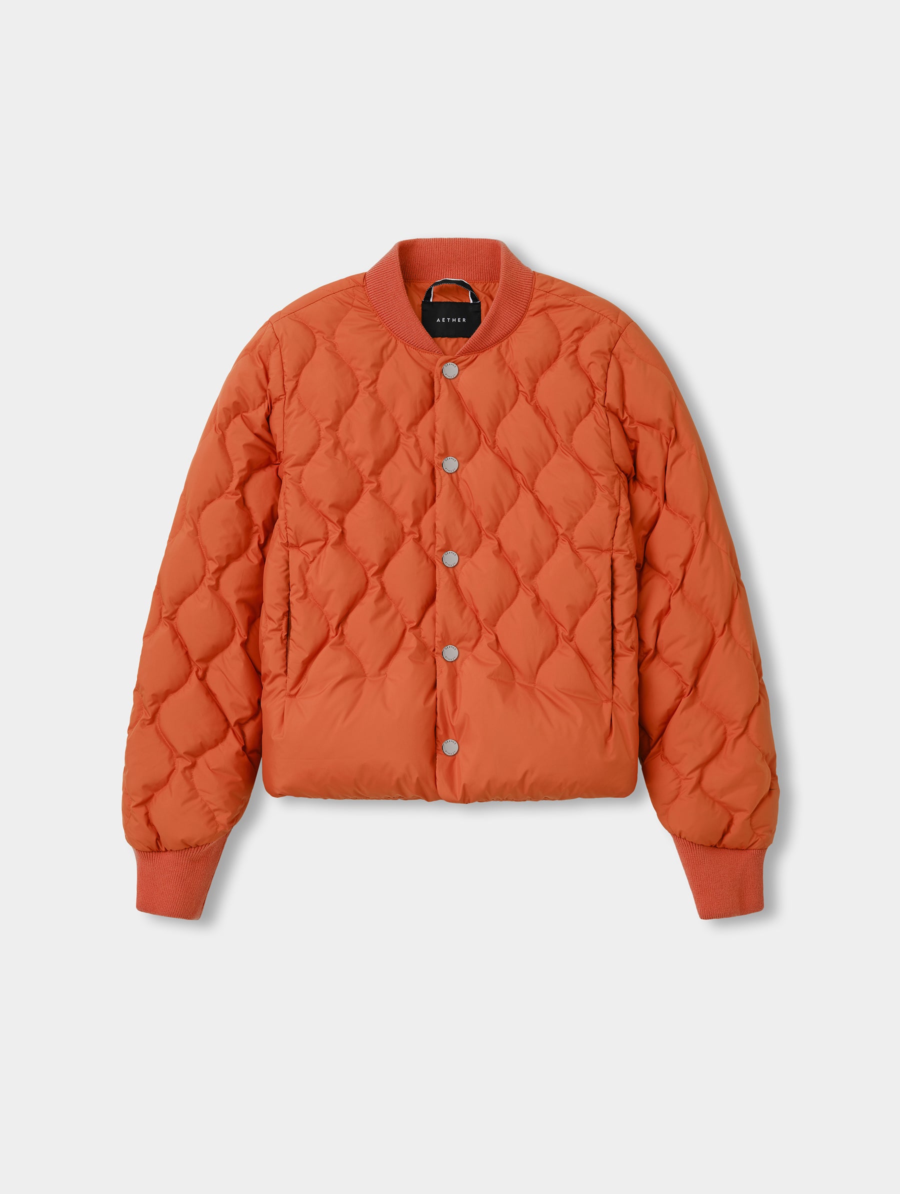 Flat lay view of the Stella Liner Jacket in Madeira Orange from AETHER Apparel.