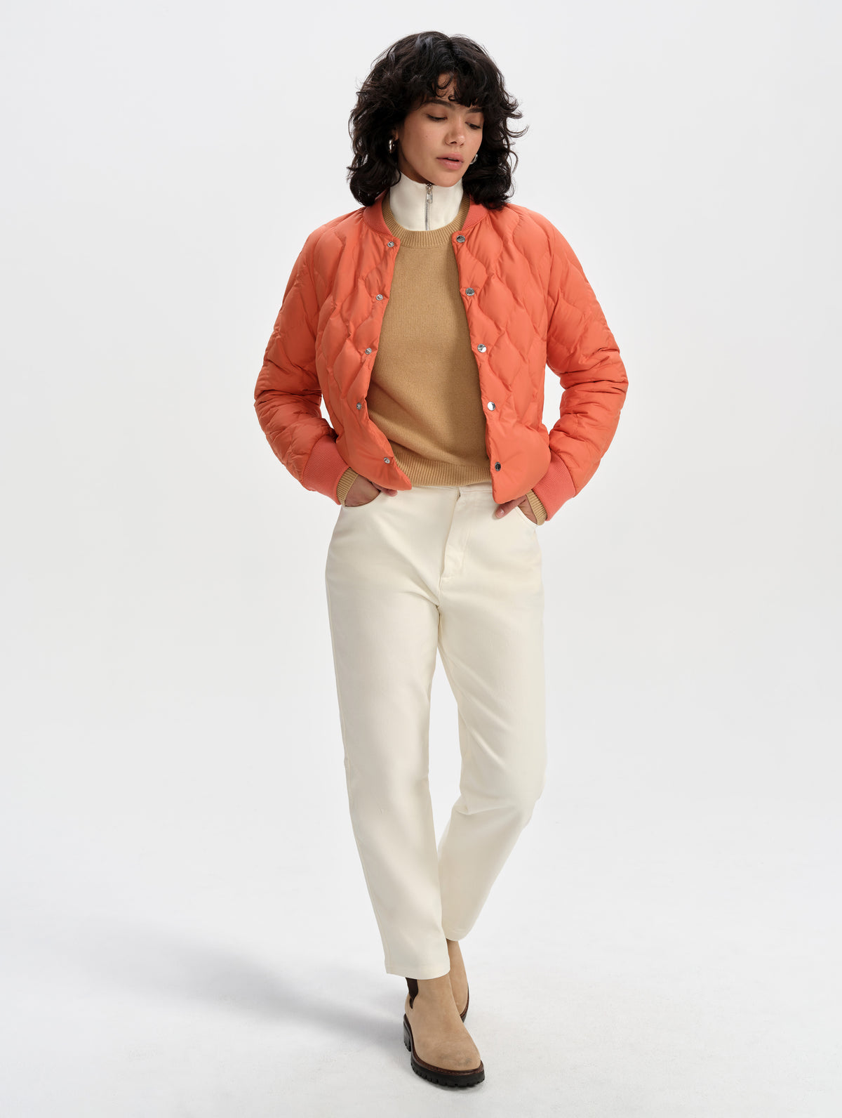 Front full-body view of woman wearing the Stella Liner Jacket in Madeira Orange from AETHER Apparel.