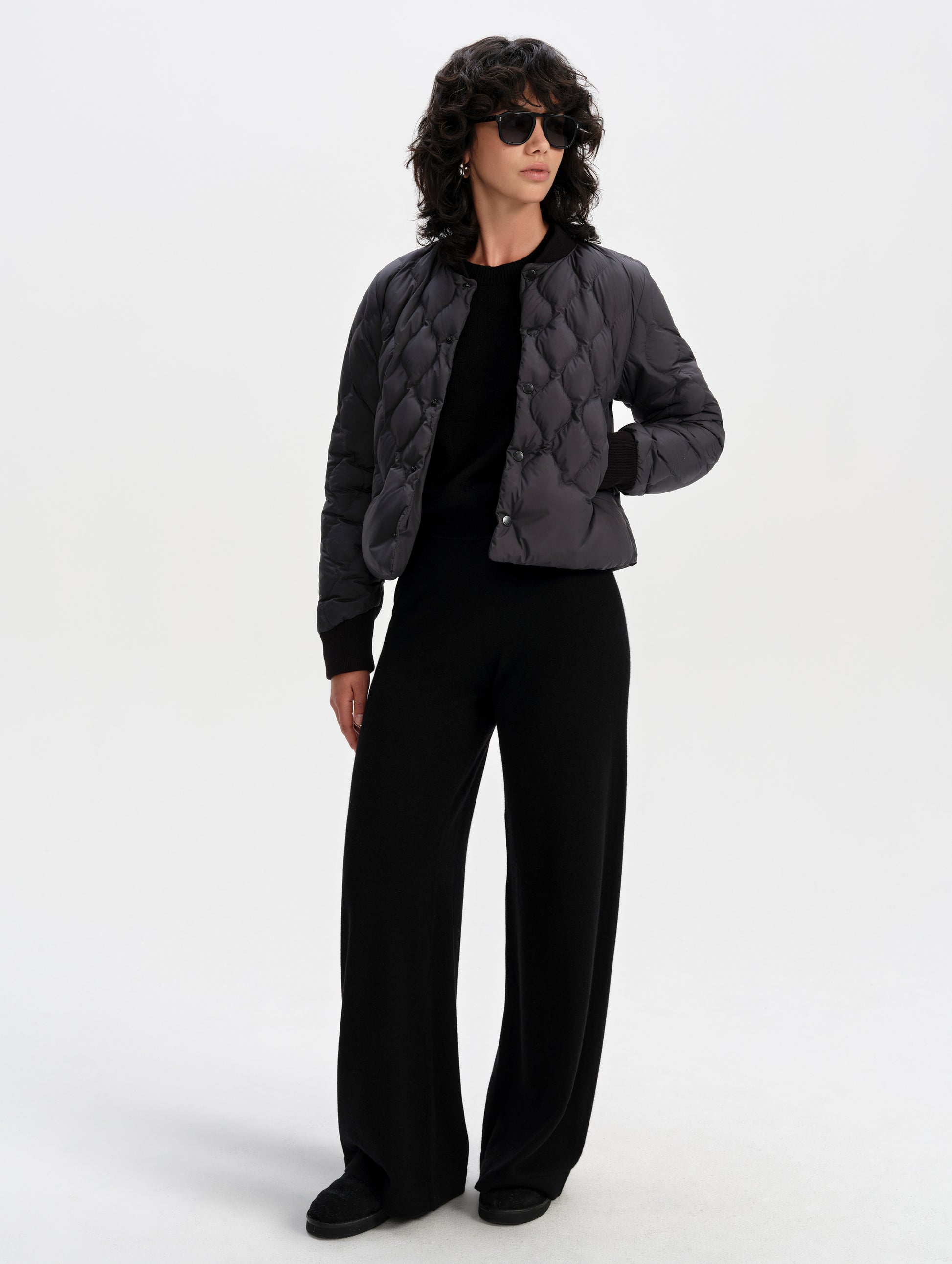 Front full-body view of woman wearing the Stella Liner Jacket in Onyx Black from AETHER Apparel.