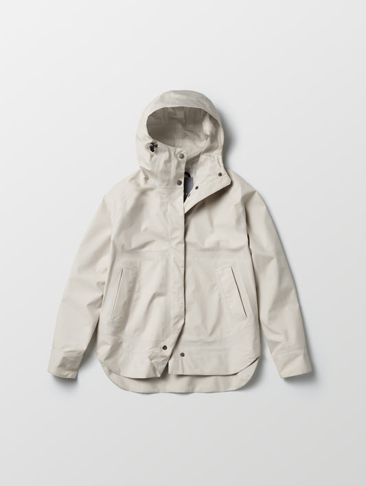 Flat lay view of women's Storm All-Weather Jacket in Bone white from AETHER Apparel.