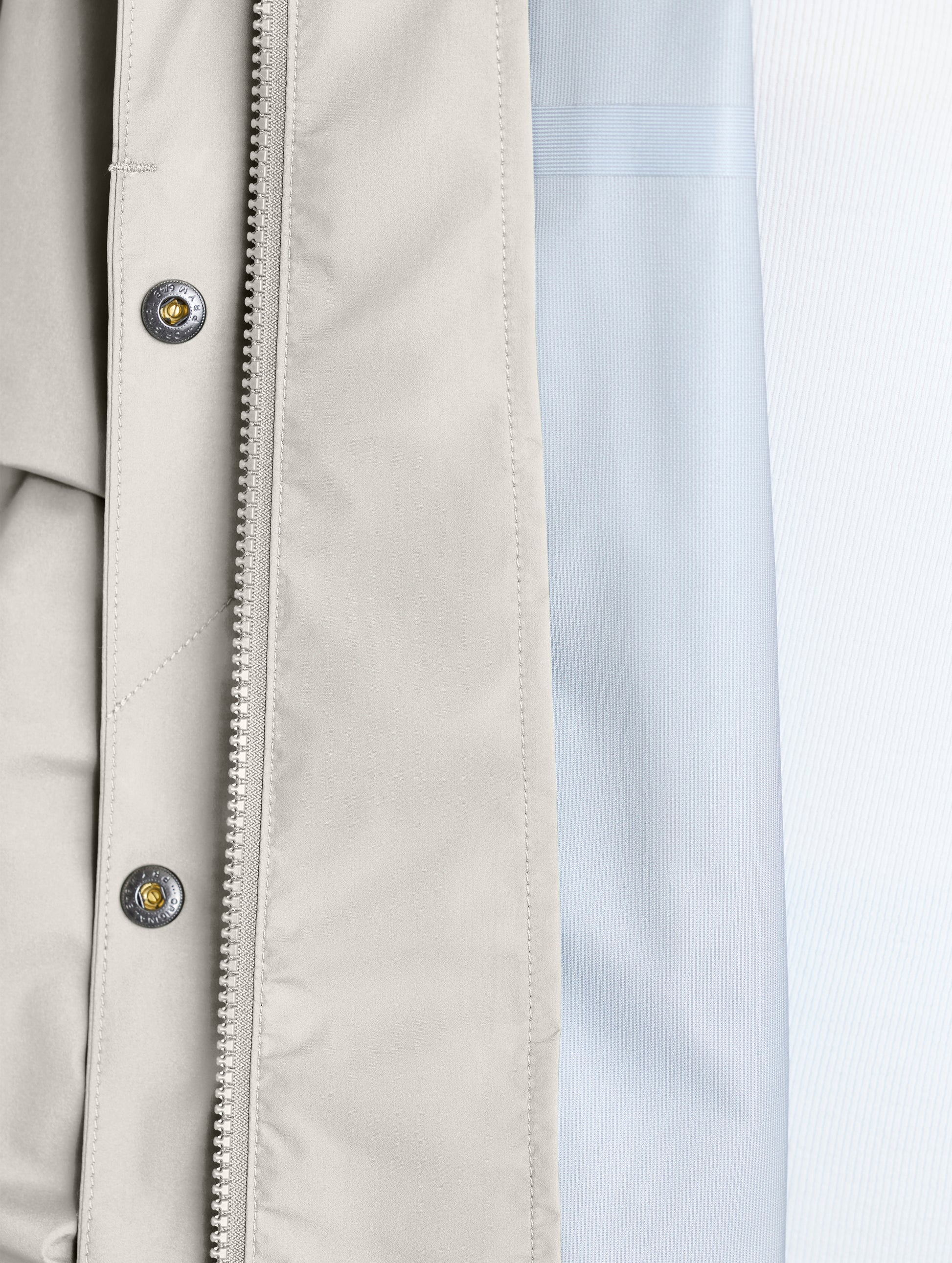 Closeup view of interior left of Storm All-Weather Jacket in Bone white from AETHER Apparel.