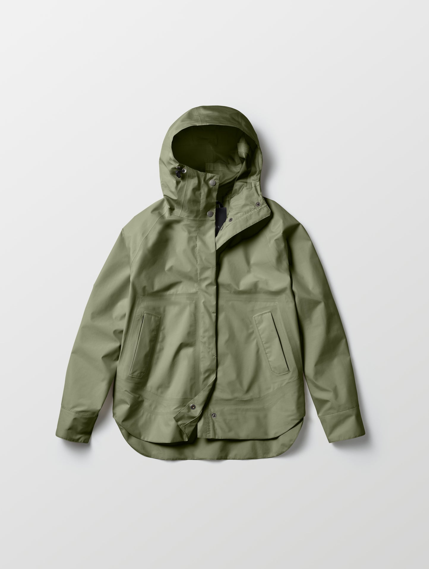 Flat lay of women's Storm All-Weather Jacket in Fern Green from AETHER Apparel.