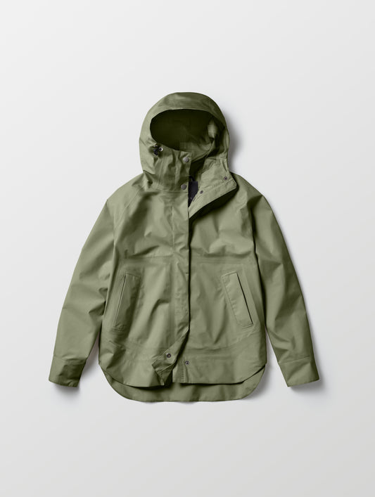Flat lay of women's Storm All-Weather Jacket in Fern Green from AETHER Apparel.
