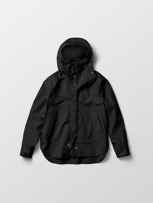 Flat lay of women's Storm All-Weather Jacket in Onyx Black from AETHER Apparel.