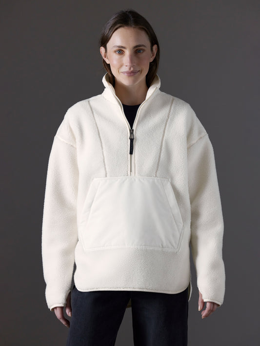 Front body view of woman wearing Terrain Fleece Anorak in Winter White from AETHER Apparel.